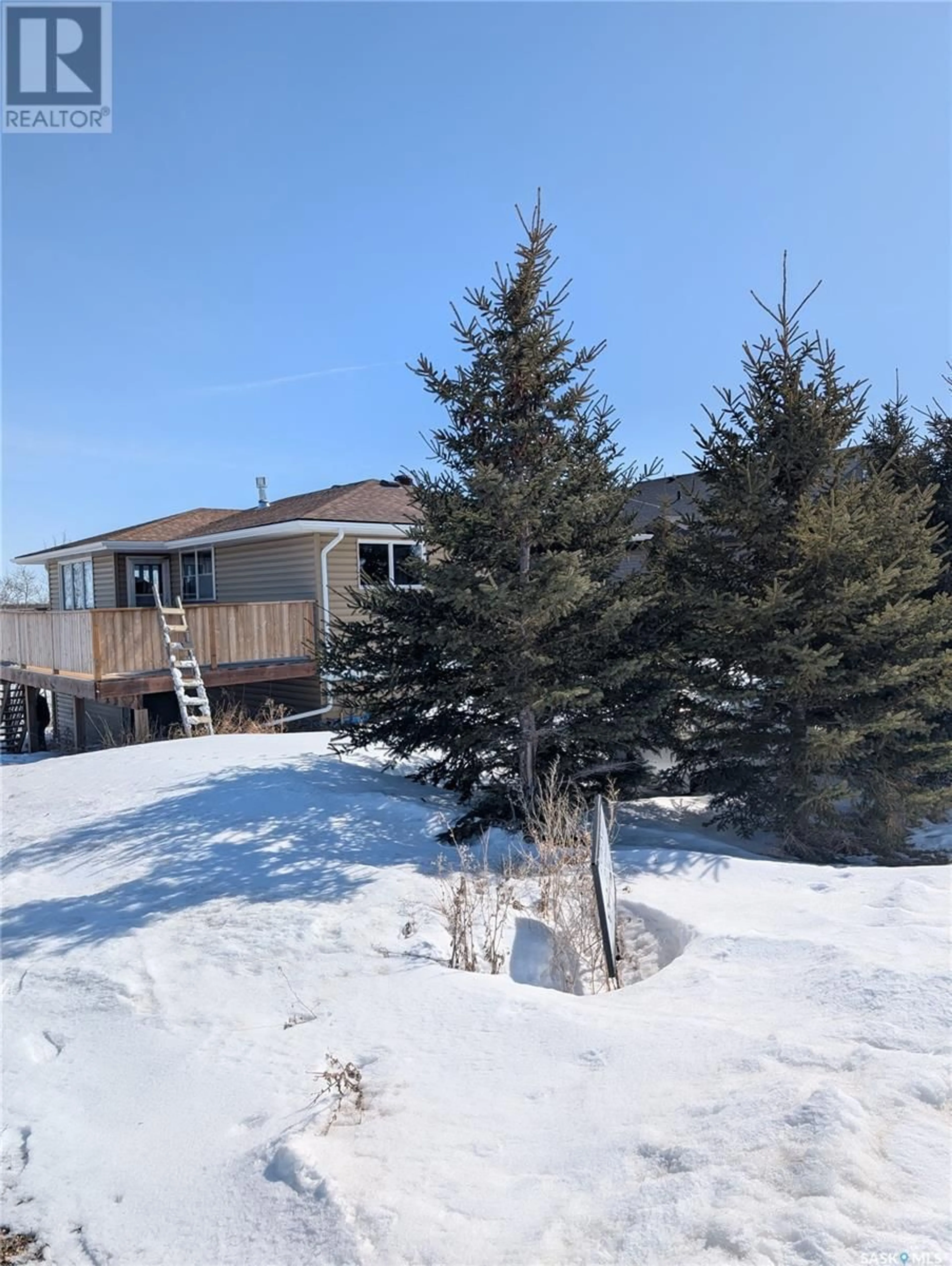A pic from outside/outdoor area/front of a property/back of a property/a pic from drone, unknown for 124 BOUCHARD LANE, Dixon Lake Saskatchewan S0K1A0