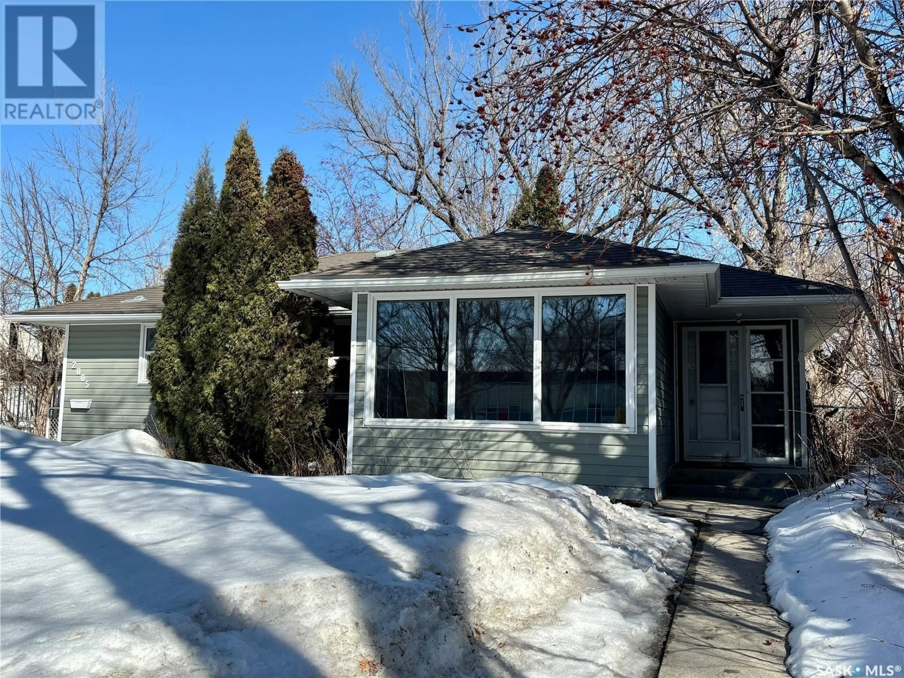 Home with vinyl exterior material, street for 2005 CLARENCE AVENUE, Saskatoon Saskatchewan S7J1L2