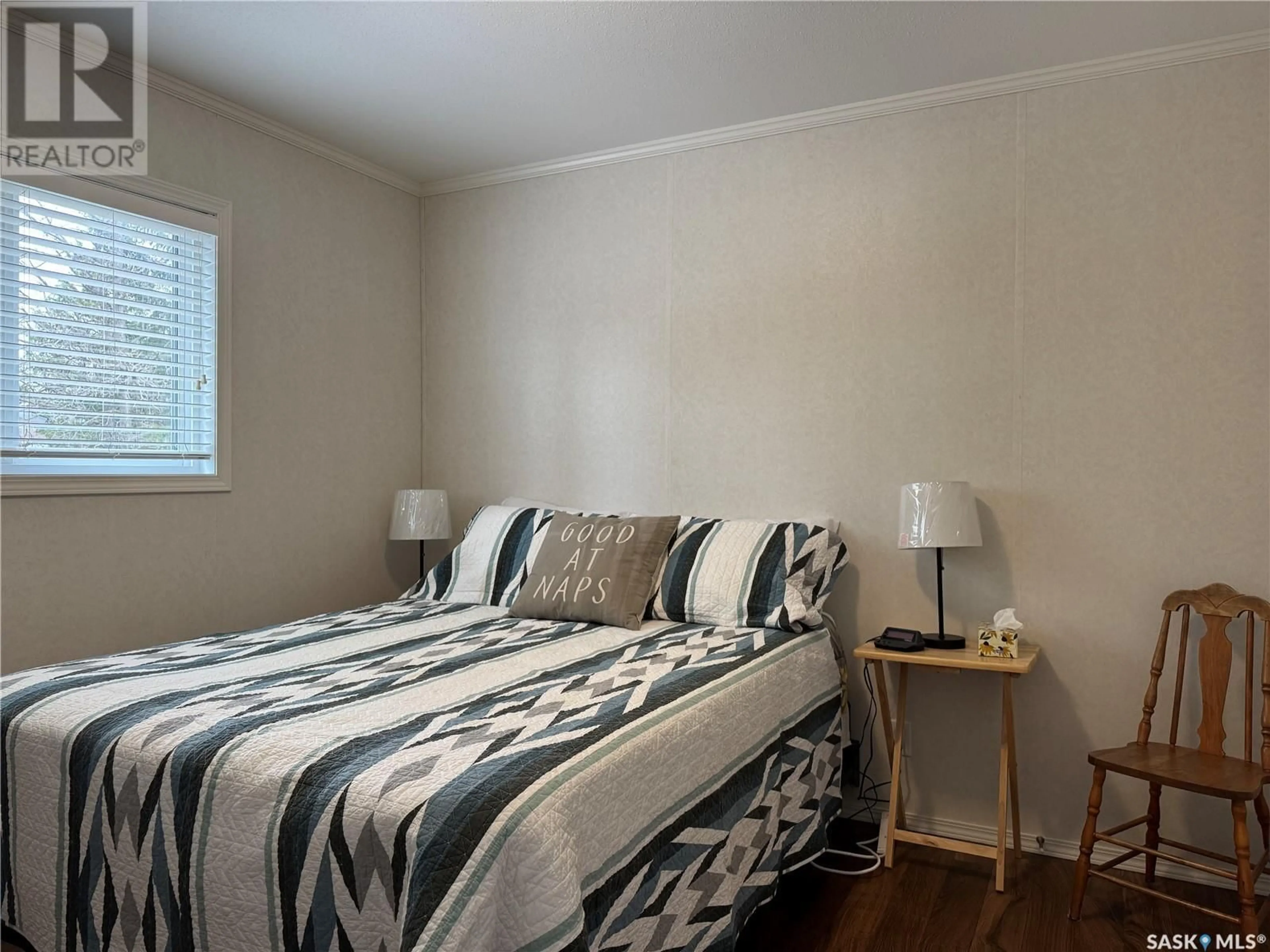 Bedroom with bed, wood/laminate floor for 226 HOPP STREET, Jansen Saskatchewan S0K2B0