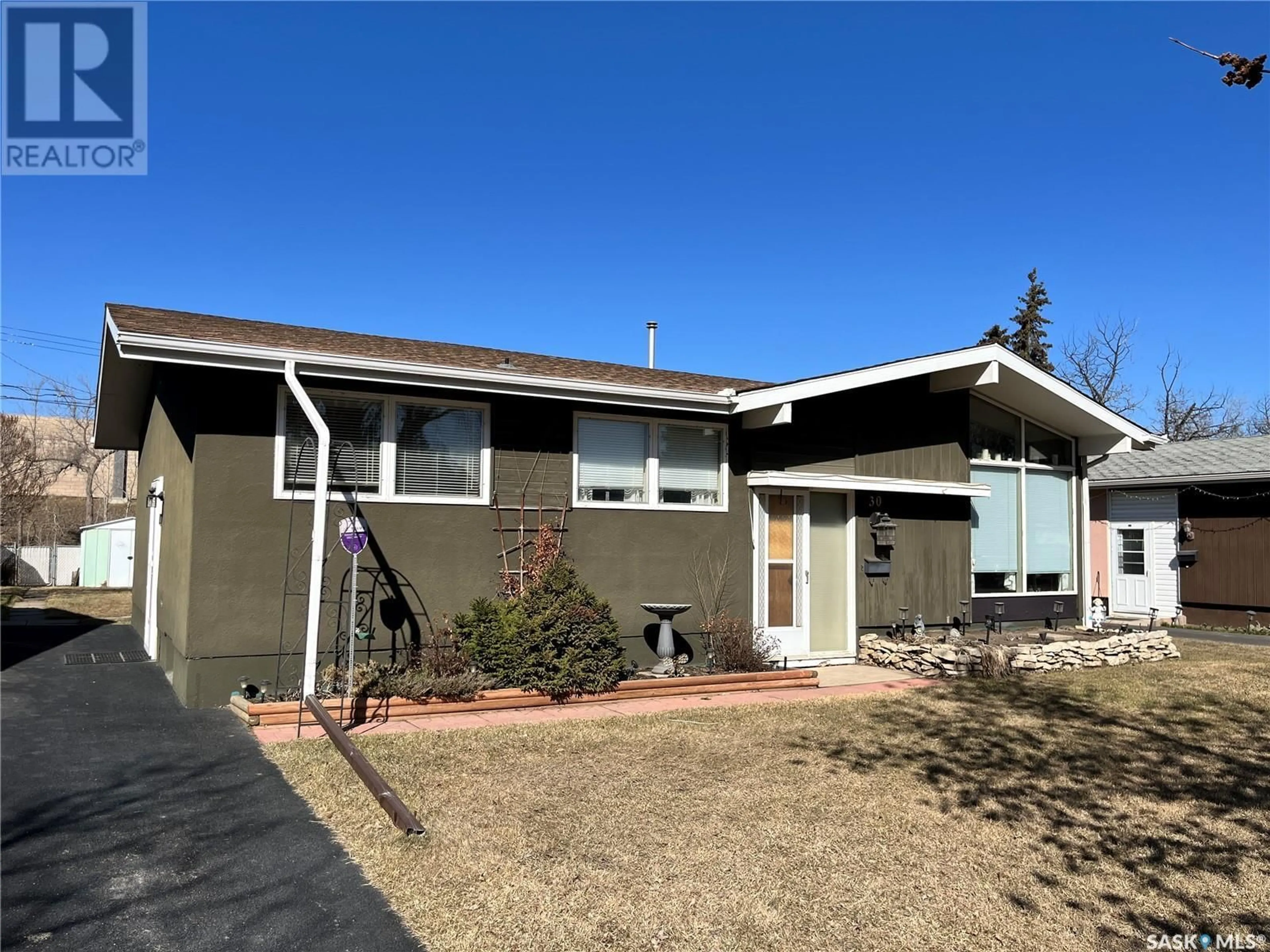 Home with vinyl exterior material, street for 30 SPINKS DRIVE, Saskatoon Saskatchewan S7H3W8