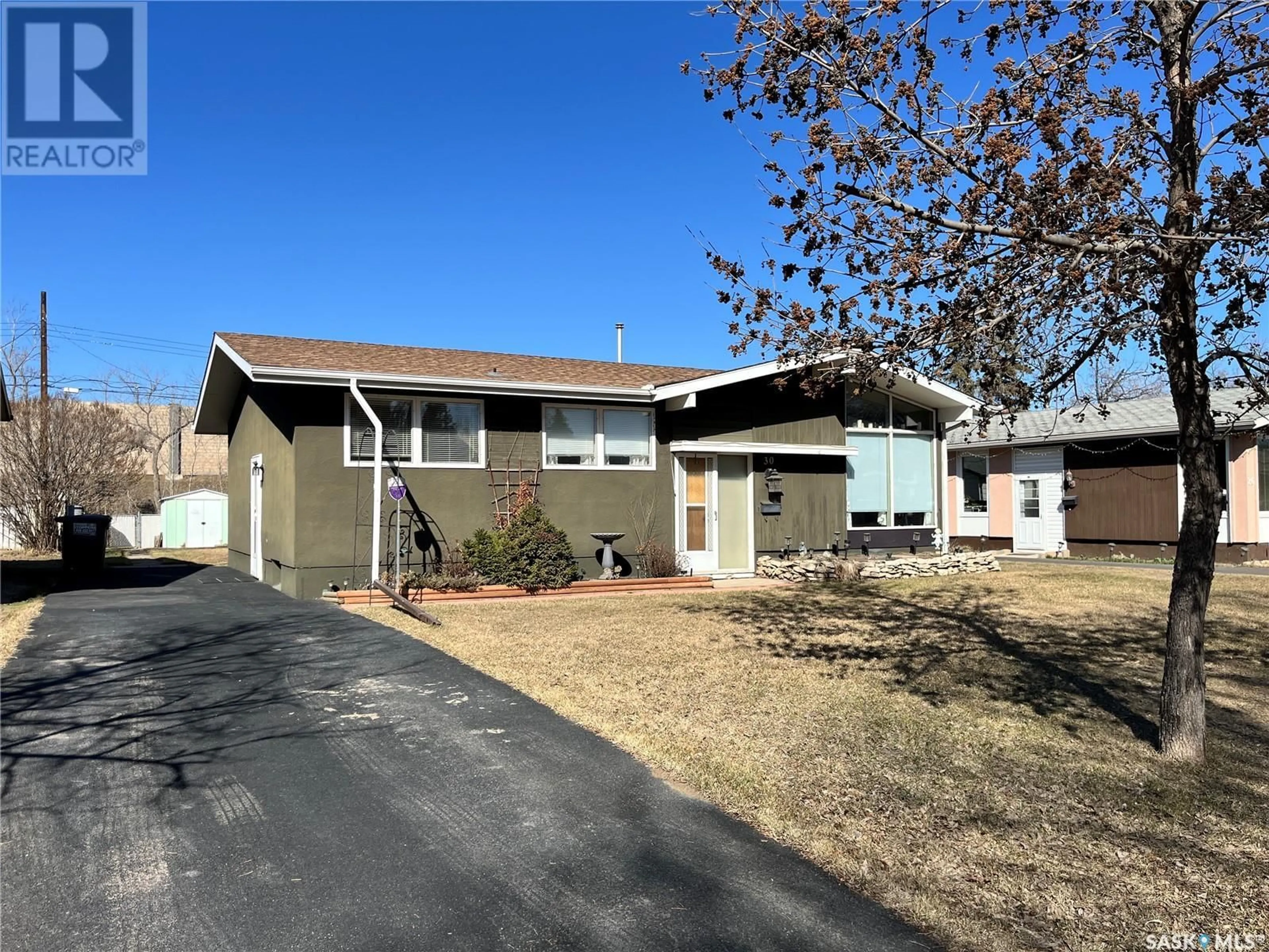 Home with vinyl exterior material, street for 30 SPINKS DRIVE, Saskatoon Saskatchewan S7H3W8