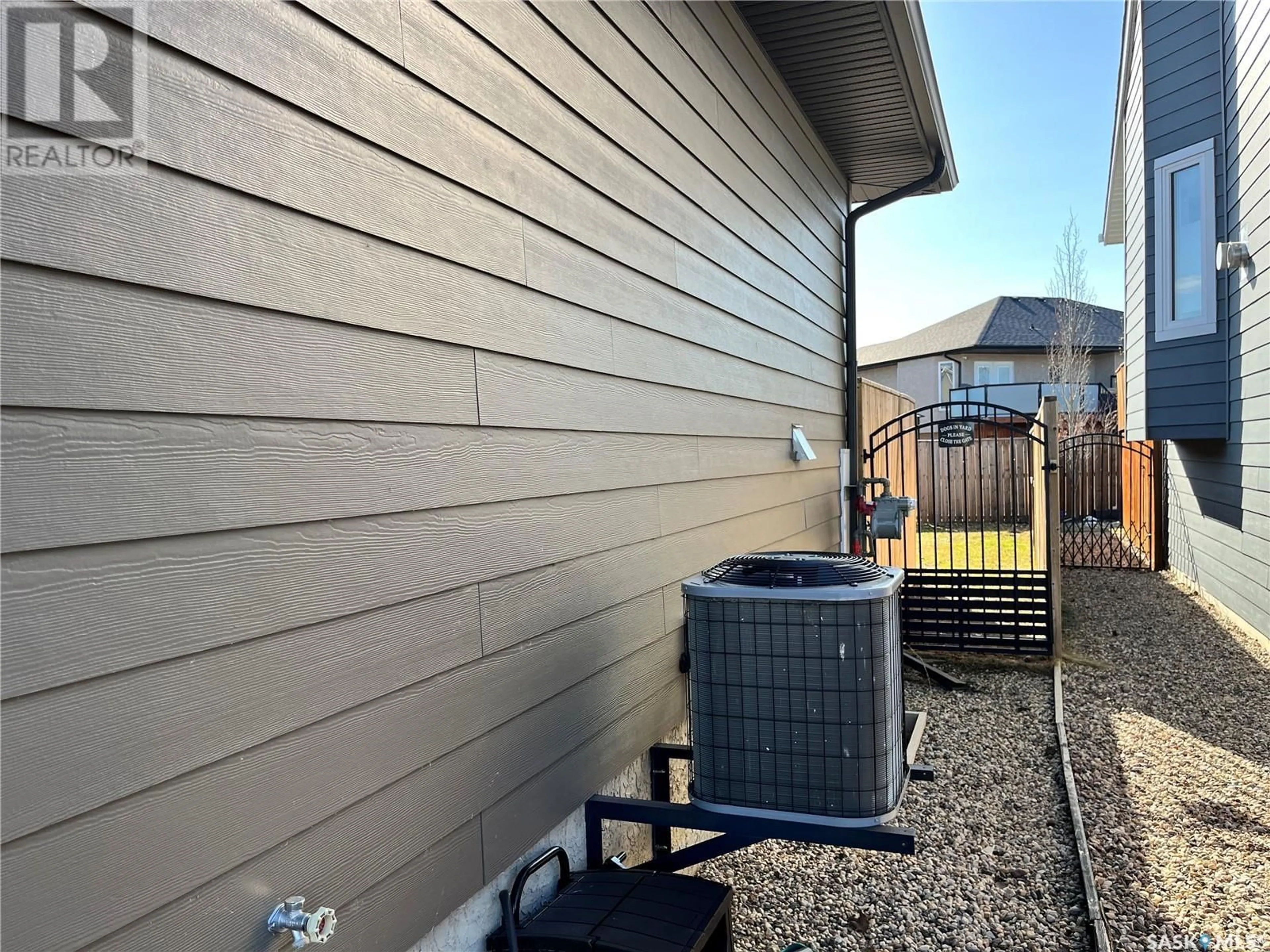 Home with vinyl exterior material, street for 207 AUGUSTA DRIVE, Warman Saskatchewan S0K4S1