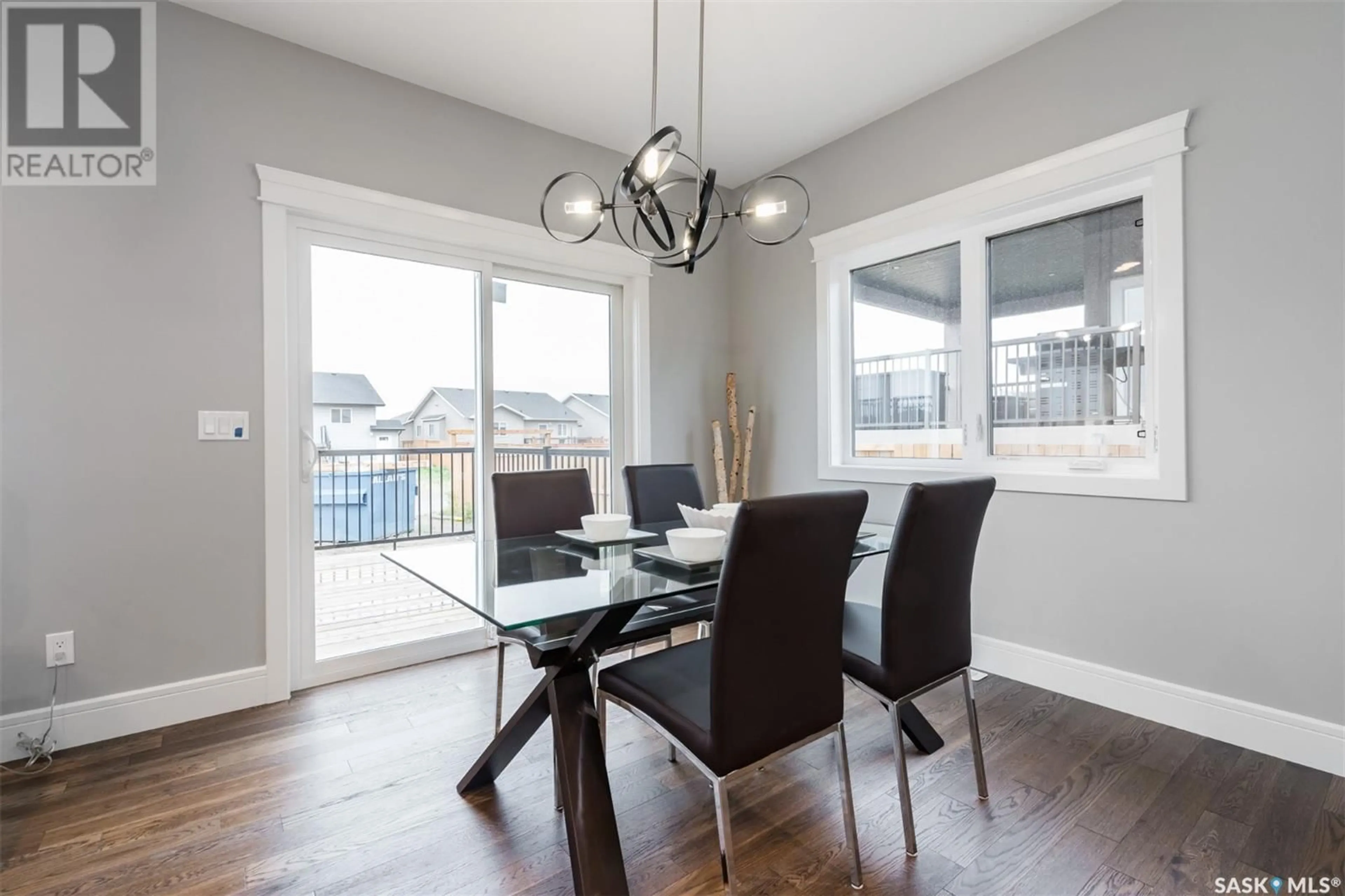 Dining room, wood/laminate floor for 178 MAZUREK CRESCENT, Saskatoon Saskatchewan S7V1S2