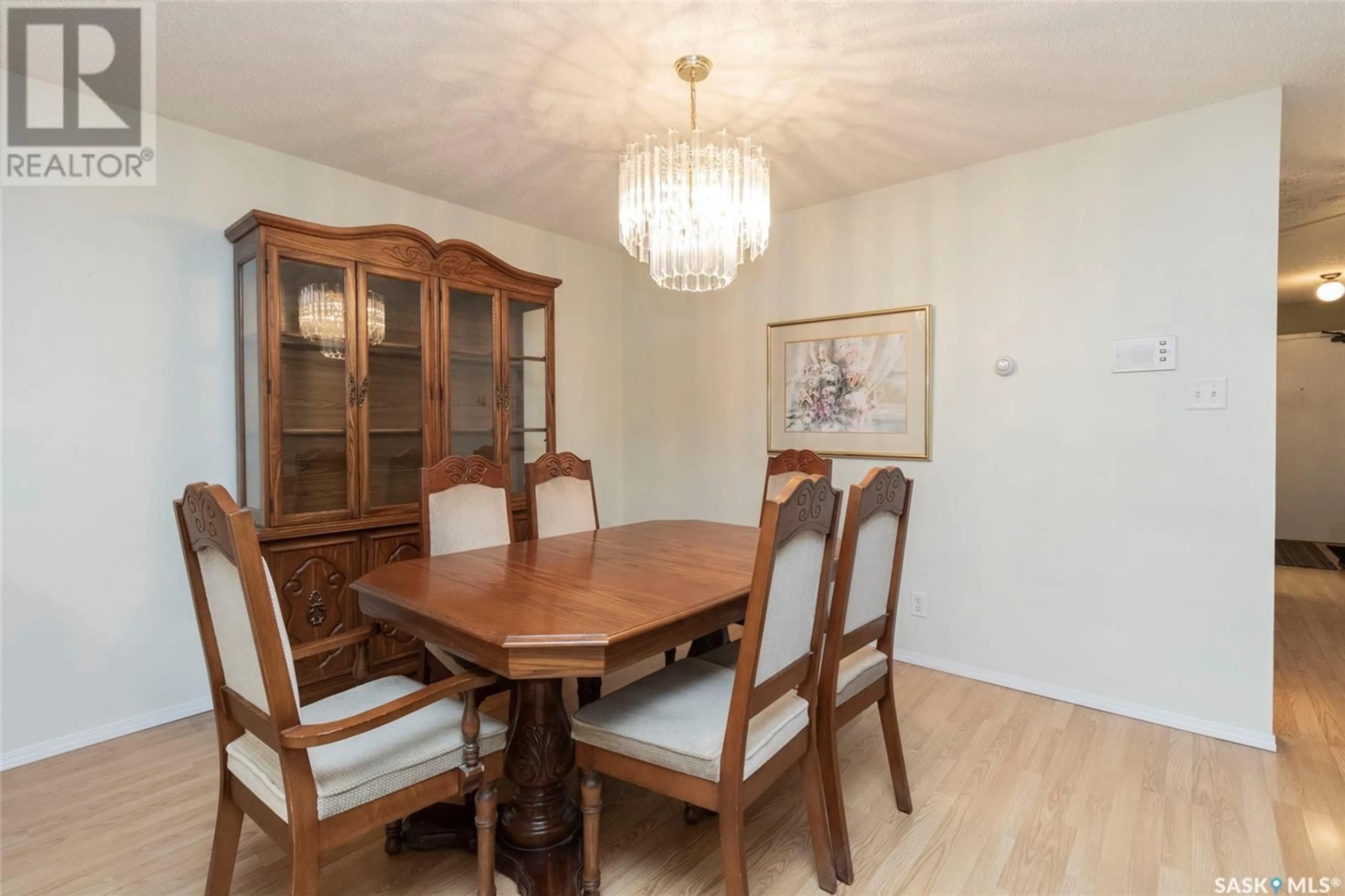 Dining room, wood/laminate floor for 101 - 1005 9TH STREET, Saskatoon Saskatchewan S7H0N3