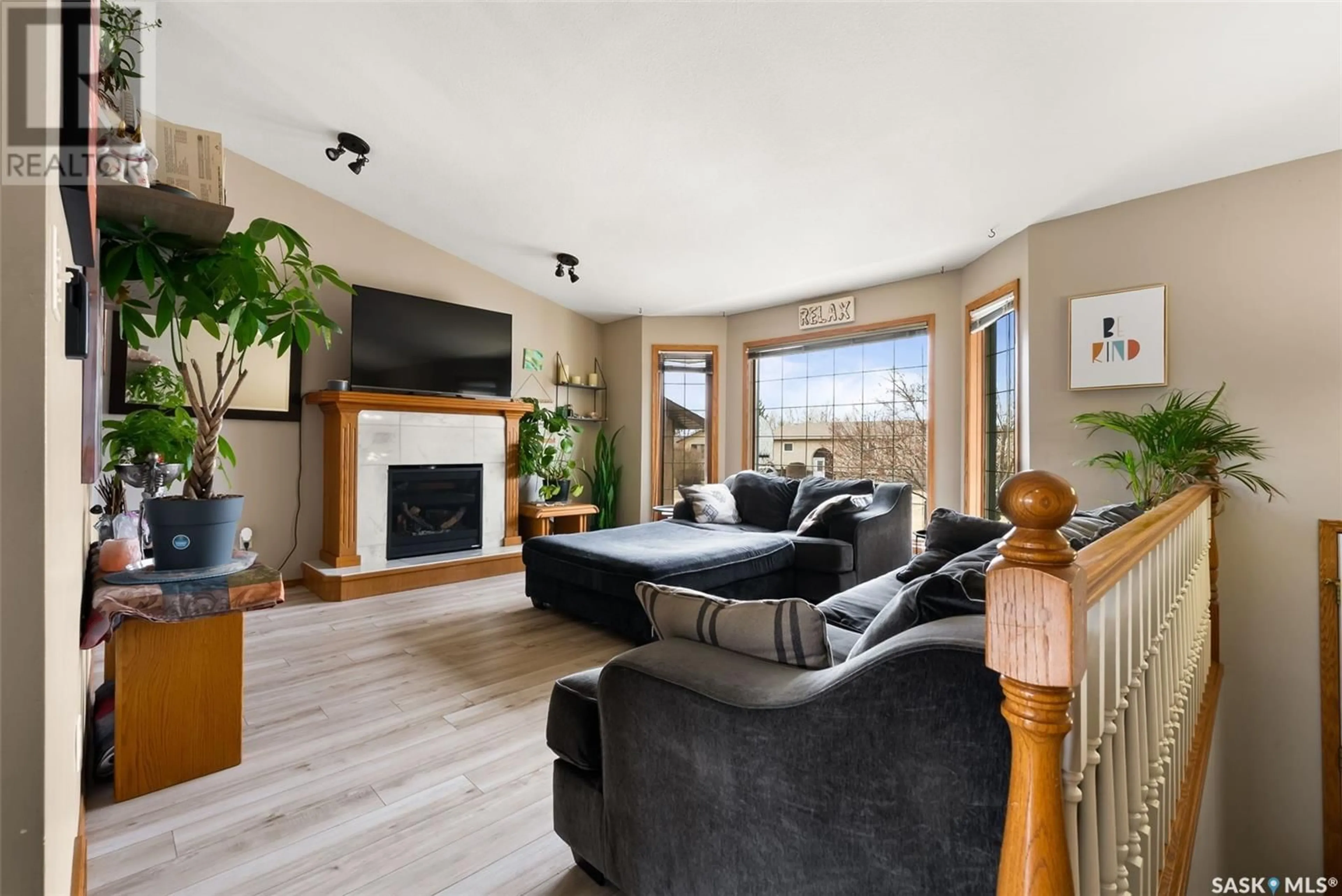 Living room with furniture, wood/laminate floor for 41 HAUGEN BAY, Mclean Saskatchewan S0G3E0