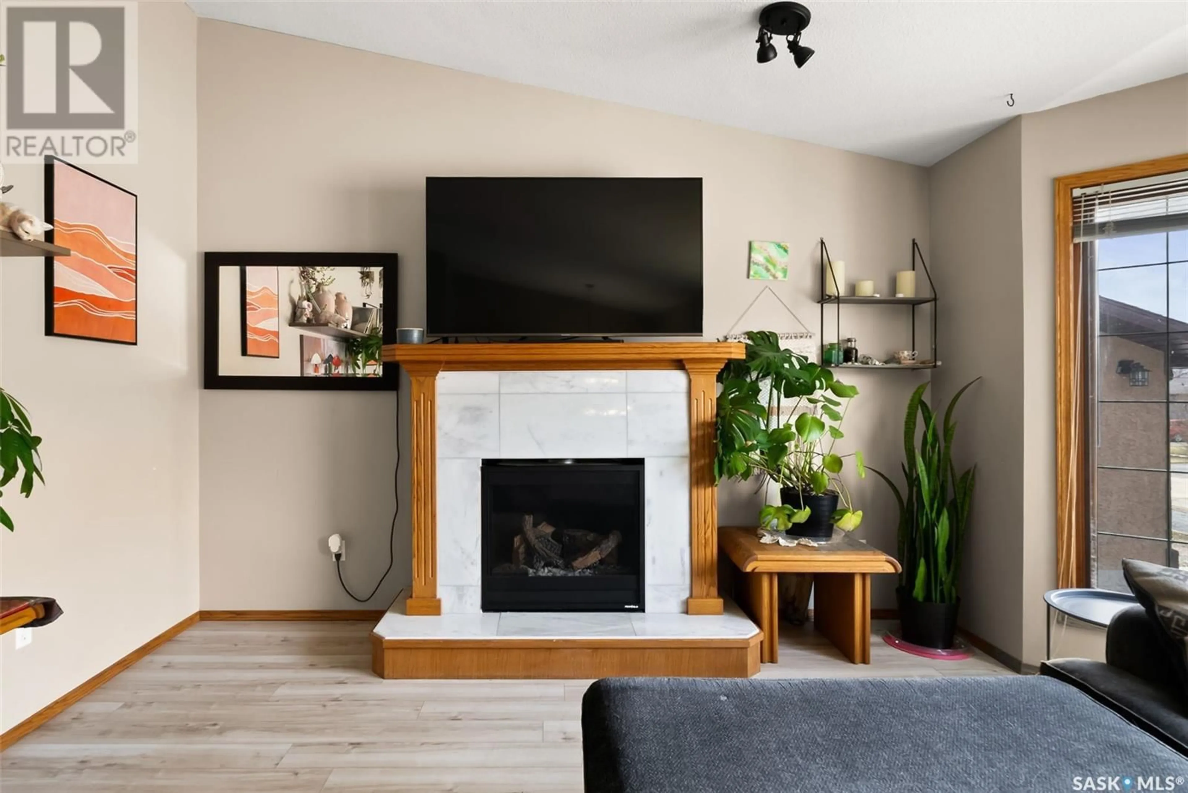Living room with furniture, wood/laminate floor for 41 HAUGEN BAY, Mclean Saskatchewan S0G3E0