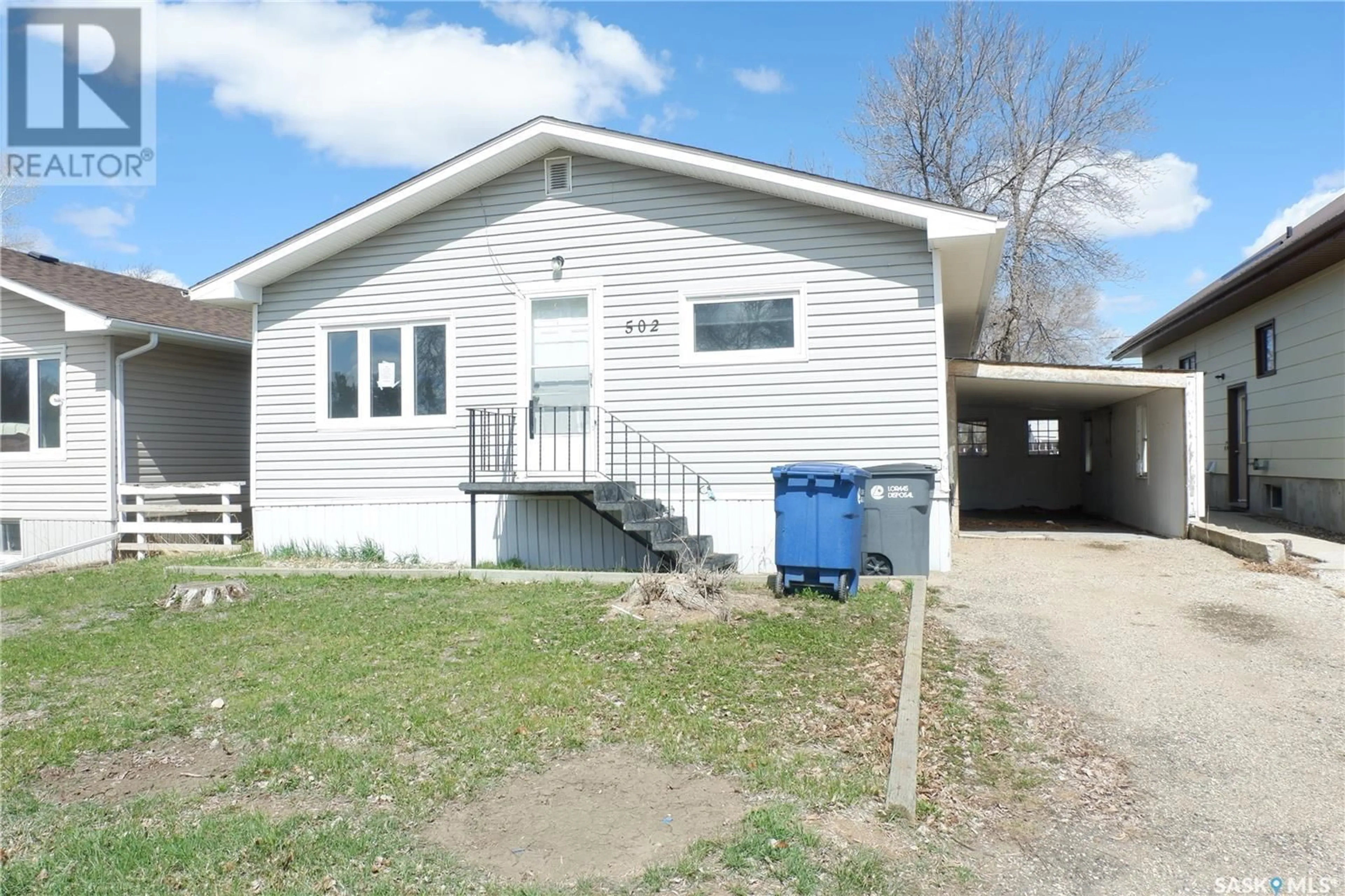 Home with vinyl exterior material, street for 502 5TH AVENUE, Assiniboia Saskatchewan S0H0B0