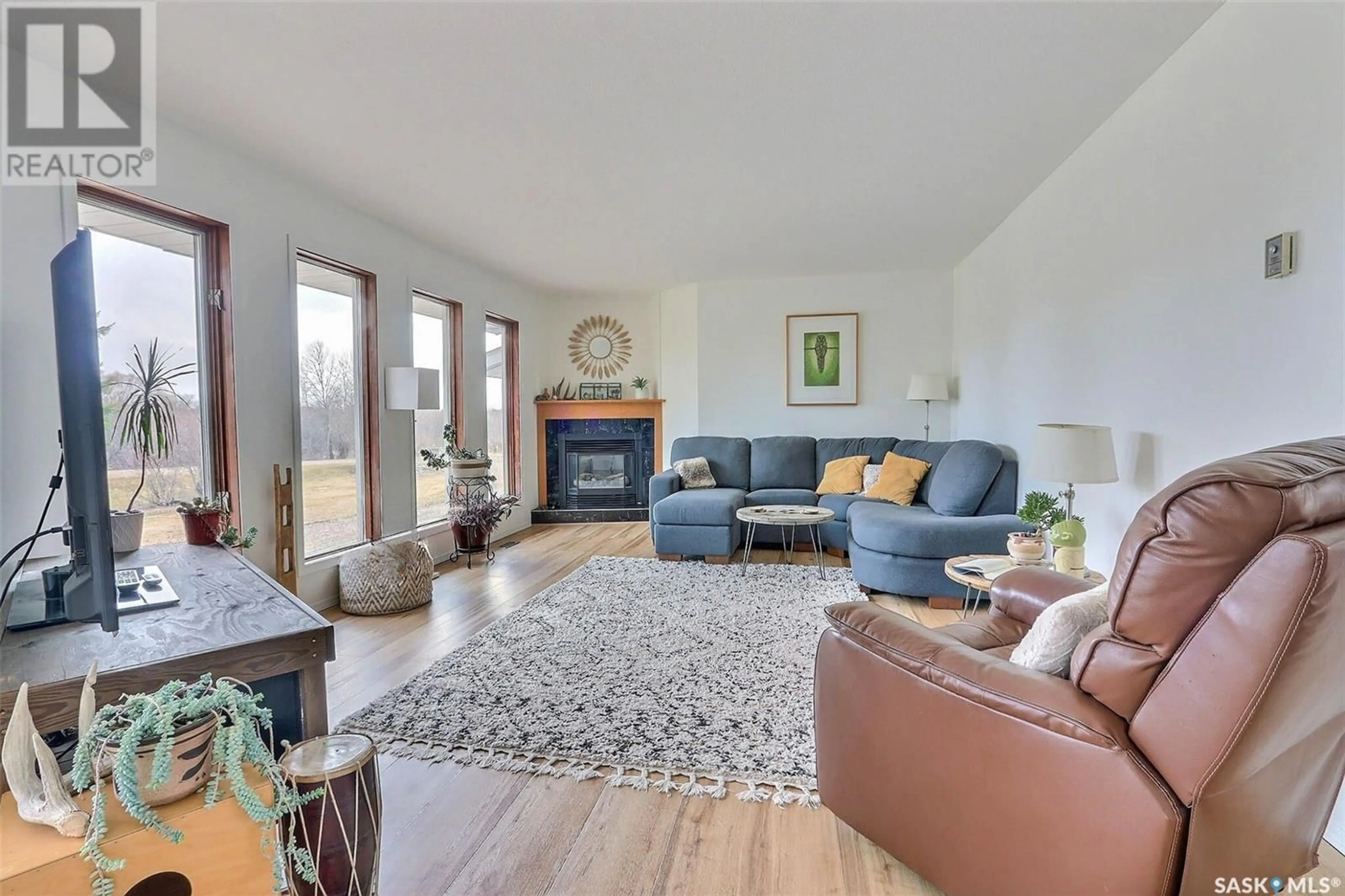 Living room with furniture, wood/laminate floor for REDWING ACREAGE, Buckland Rm No. 491 Saskatchewan S6V5R3