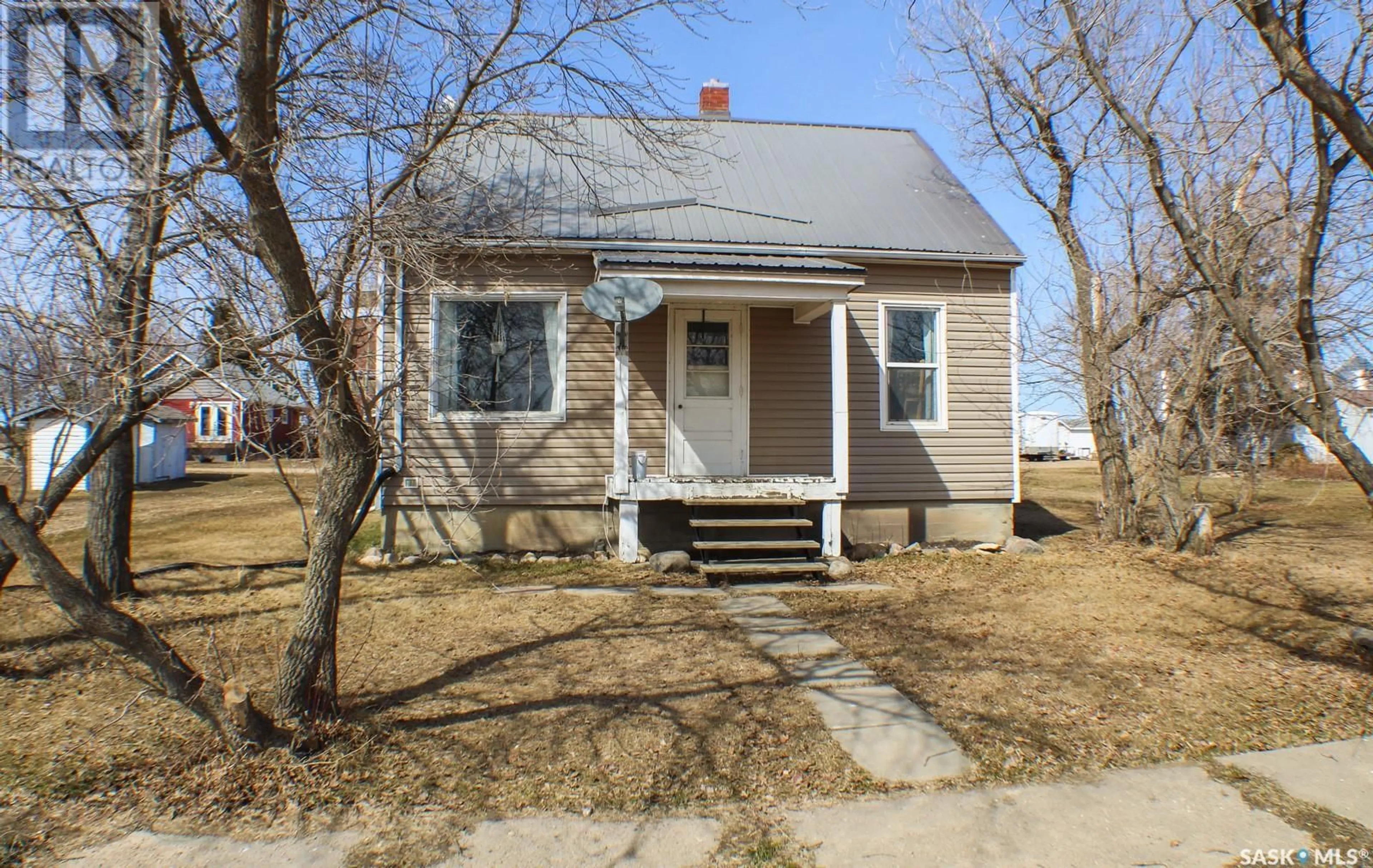 Home with vinyl exterior material, street for 235 1ST STREET, Beatty Saskatchewan S0J0C0