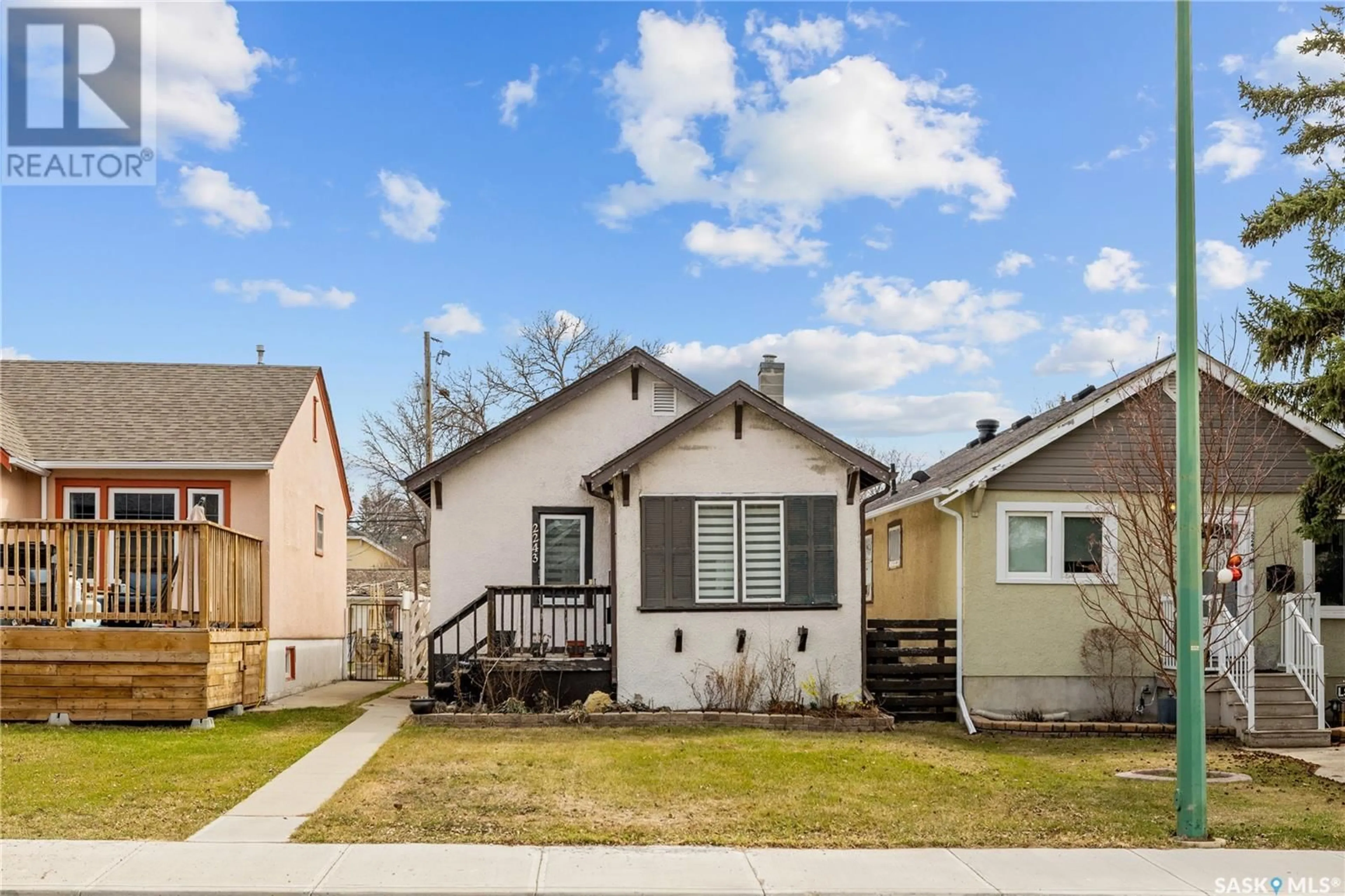 Home with vinyl exterior material, street for 2243 QUEEN STREET, Regina Saskatchewan S4T4C6