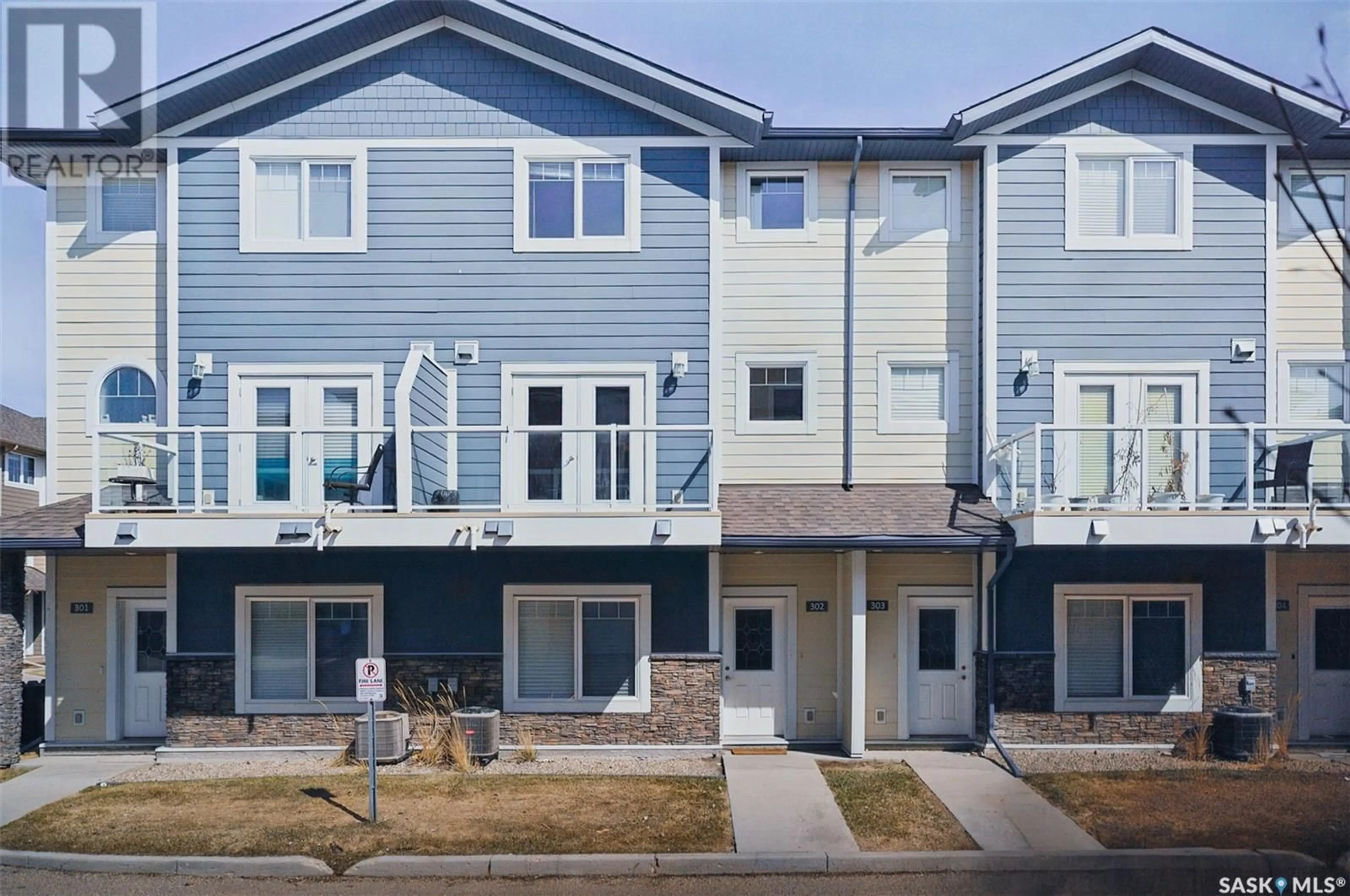 Home with vinyl exterior material, street for 302 212 WILLIS CRESCENT, Saskatoon Saskatchewan S7T0R6