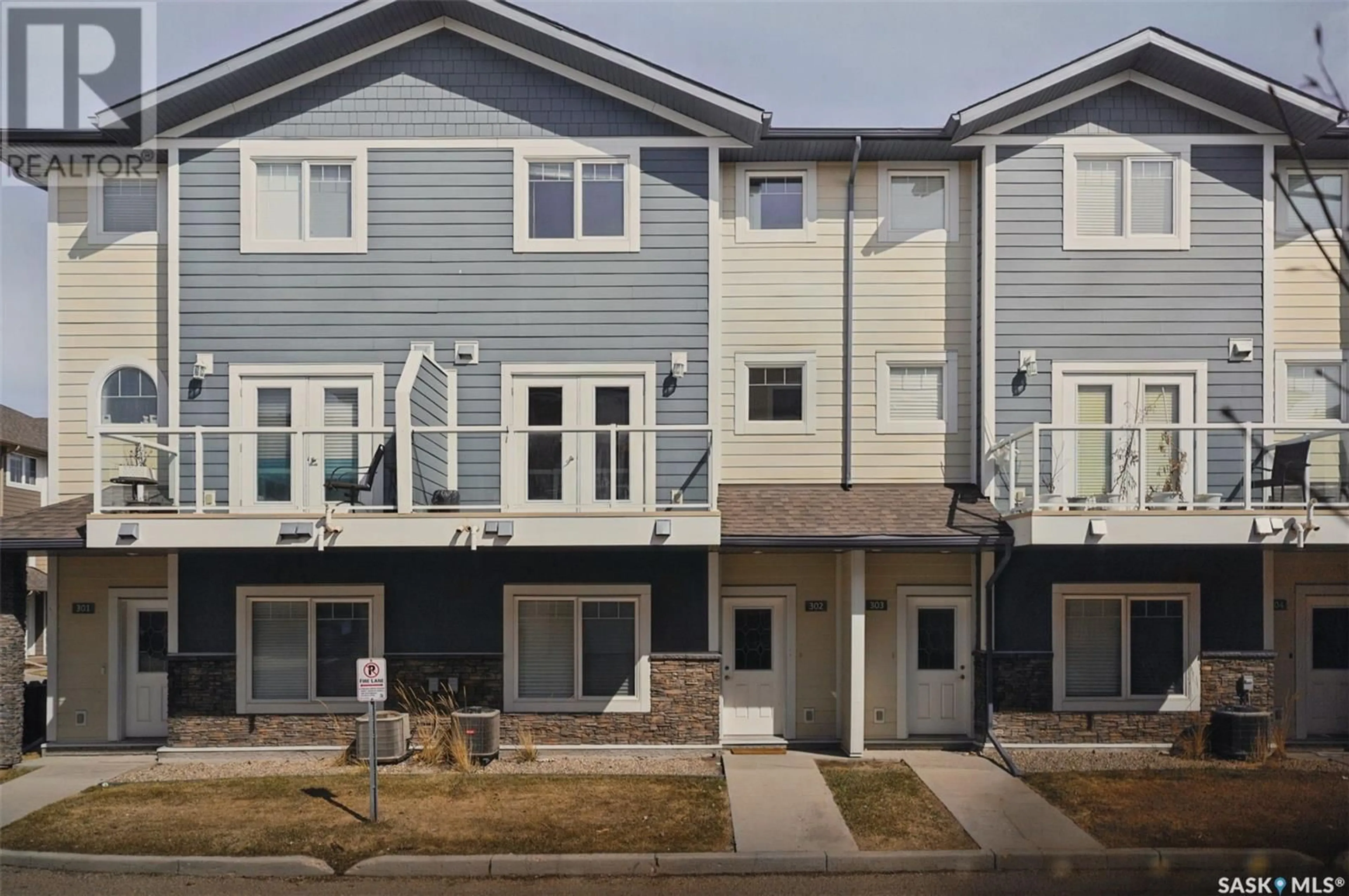 Home with vinyl exterior material, street for 302 212 WILLIS CRESCENT, Saskatoon Saskatchewan S7T0R6