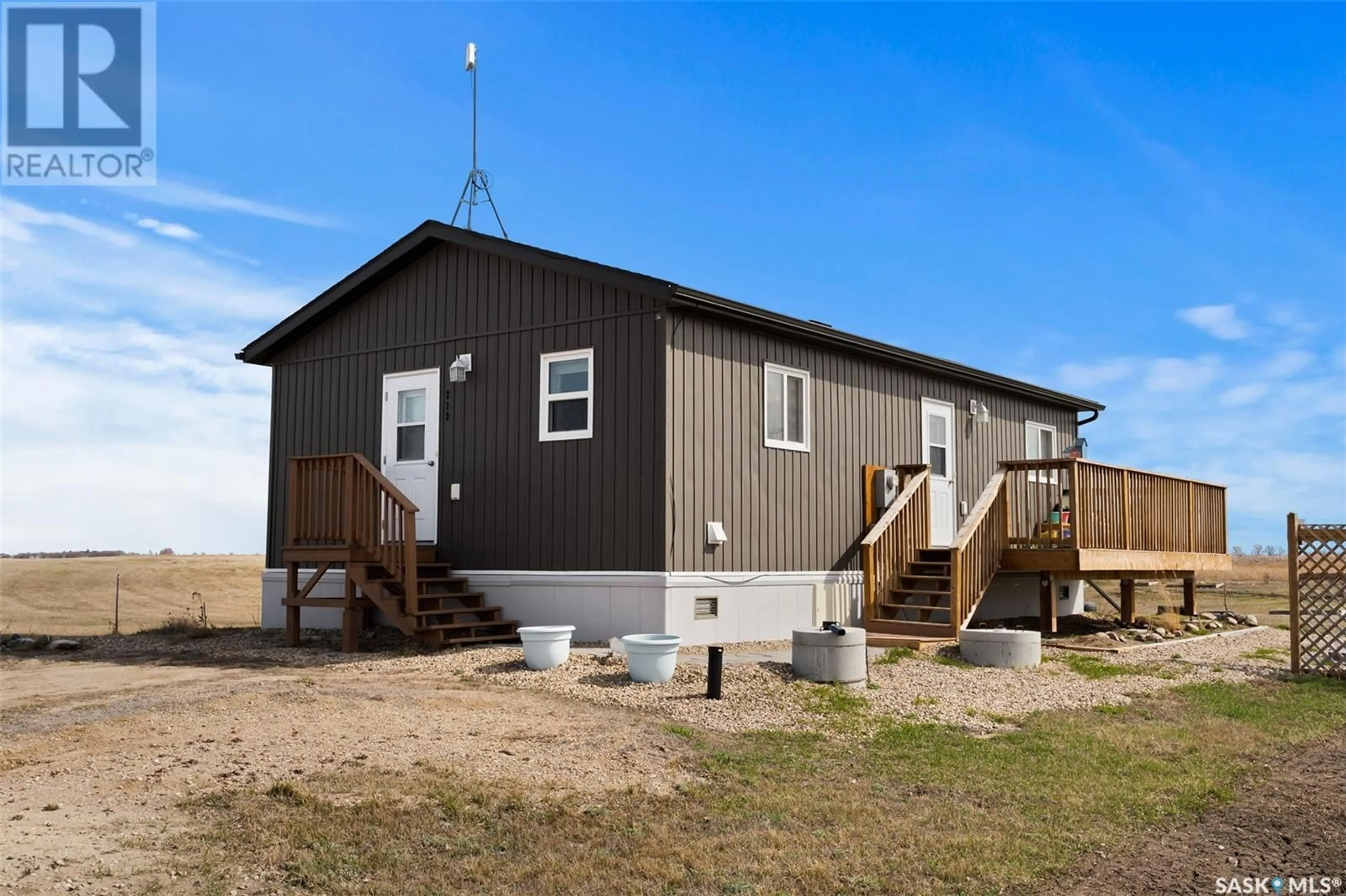 A pic from outside/outdoor area/front of a property/back of a property/a pic from drone, building for 213 BARBER ROAD, Collingwood Lakeshore Estates Saskatchewan S0G4V0