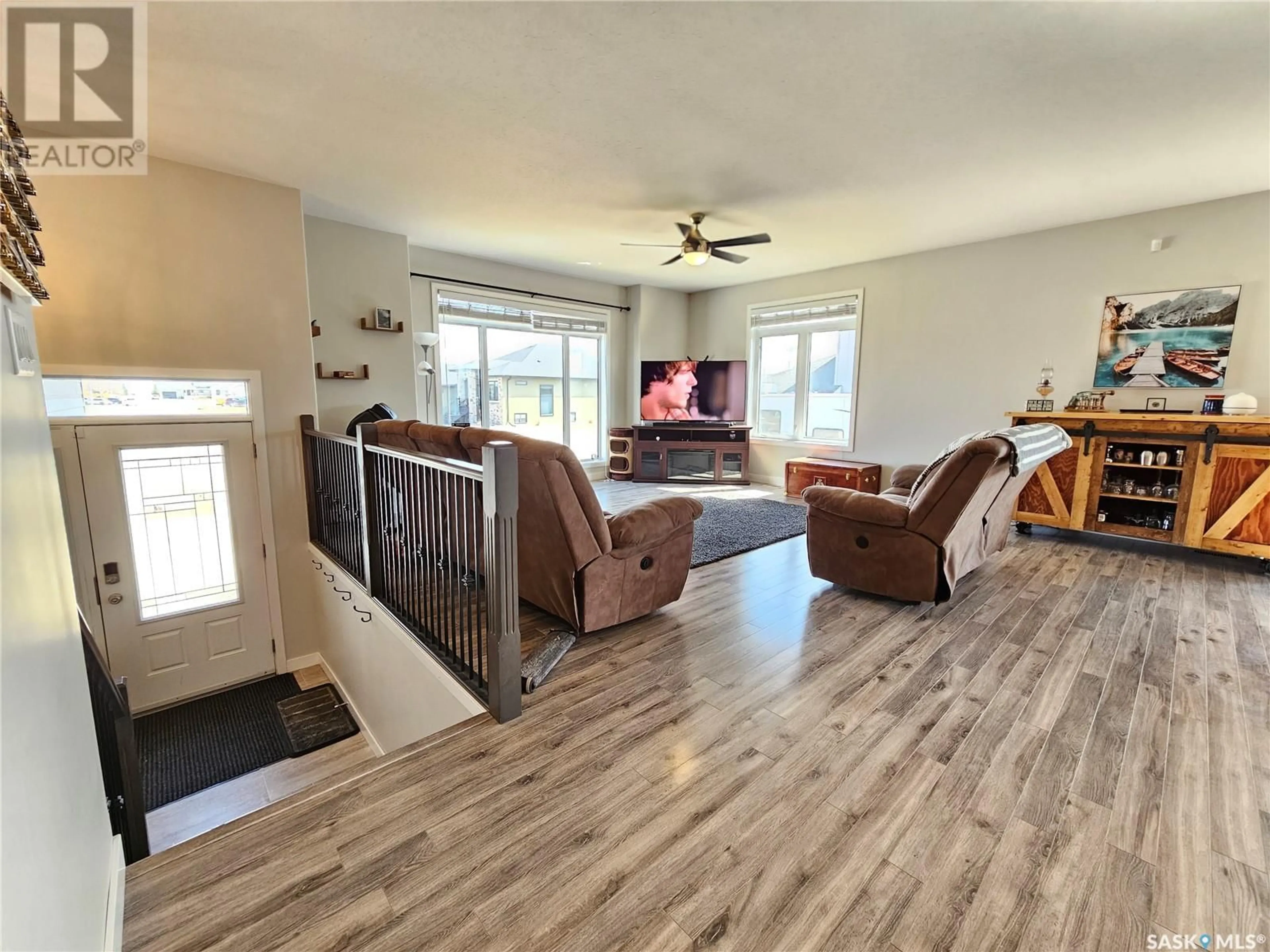 Living room with furniture, wood/laminate floor for 44 GIBSON CRESCENT, Meadow Lake Saskatchewan S9X1Z9