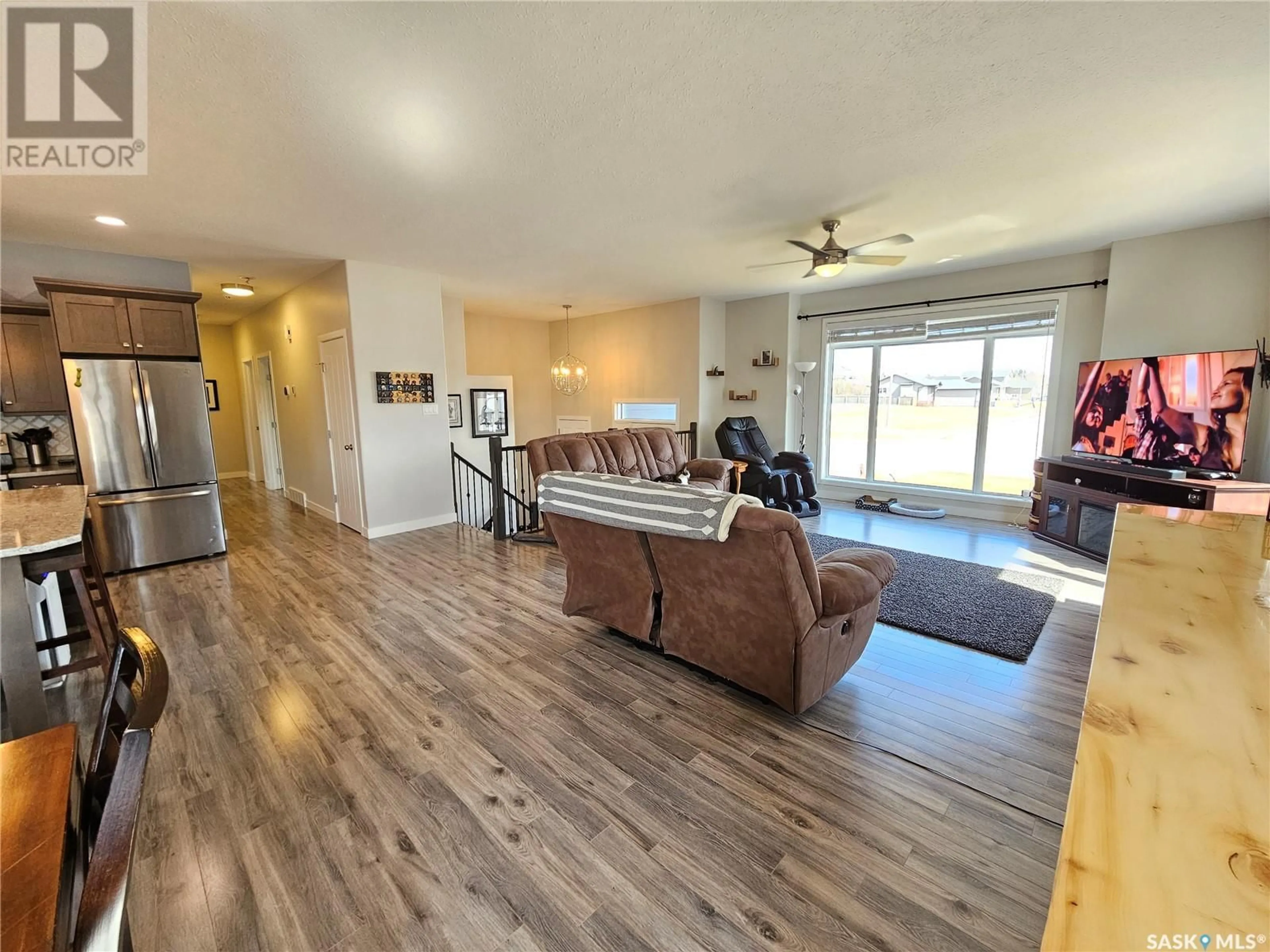 Living room with furniture, wood/laminate floor for 44 GIBSON CRESCENT, Meadow Lake Saskatchewan S9X1Z9