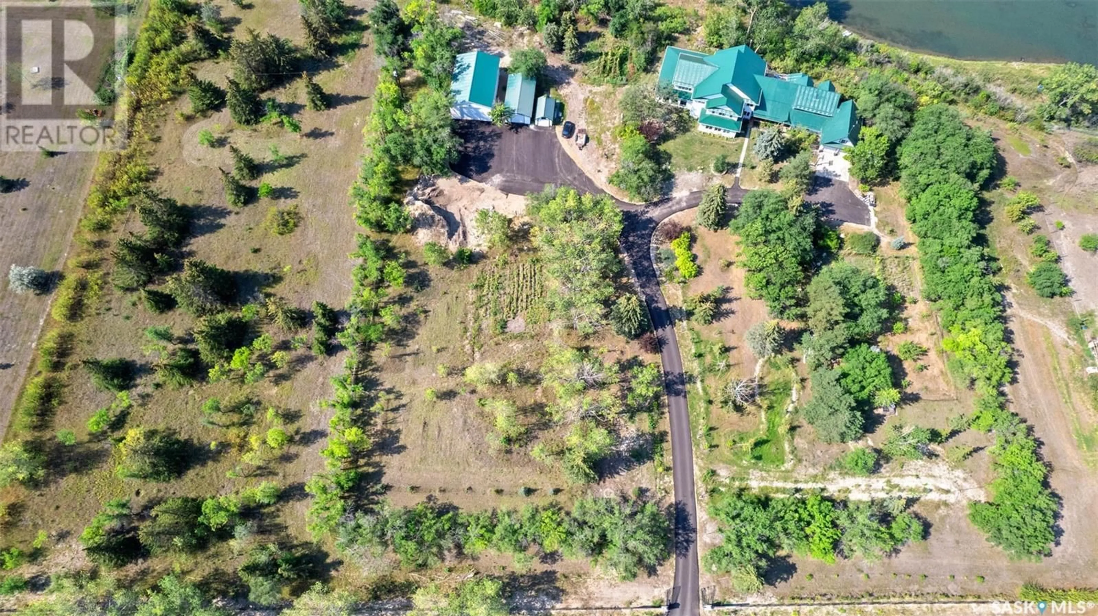 A pic from outside/outdoor area/front of a property/back of a property/a pic from drone, forest/trees view for CAO RESIDENCE, Corman Park Rm No. 344 Saskatchewan S7K3J9