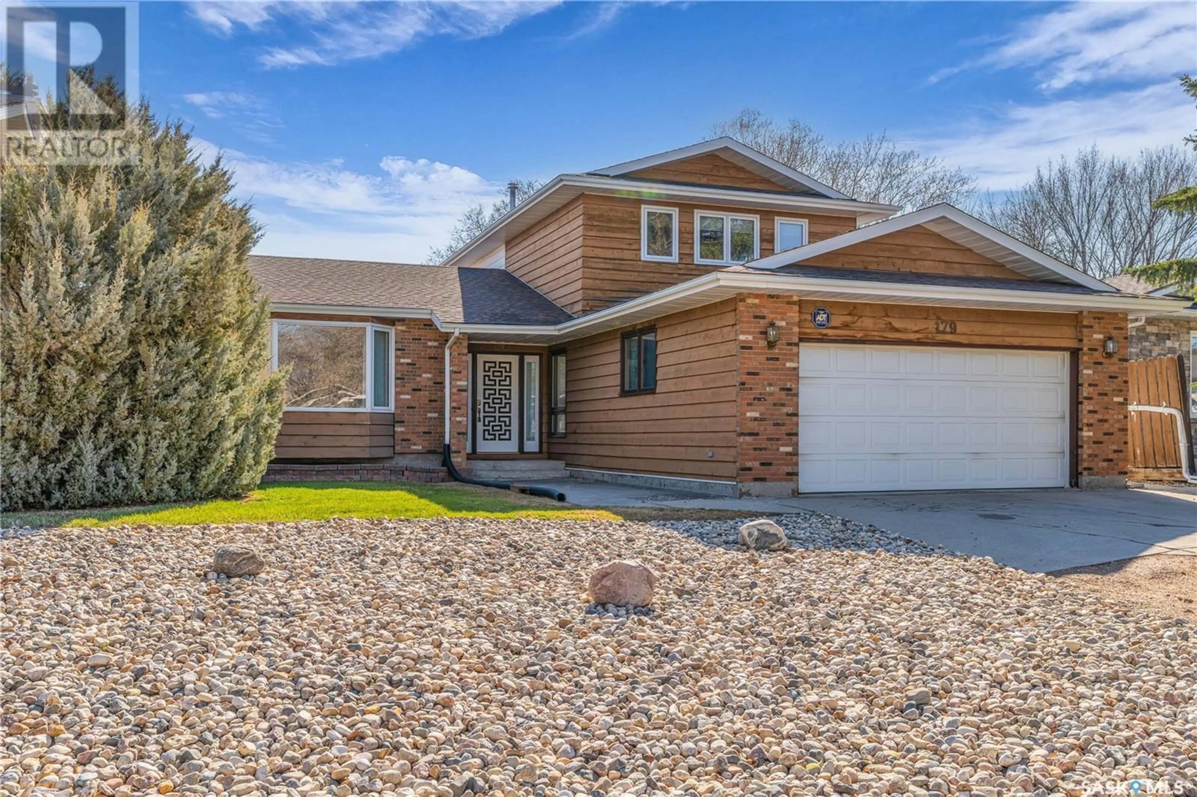 Home with brick exterior material, street for 179 ROGERS ROAD, Regina Saskatchewan S4S6V1