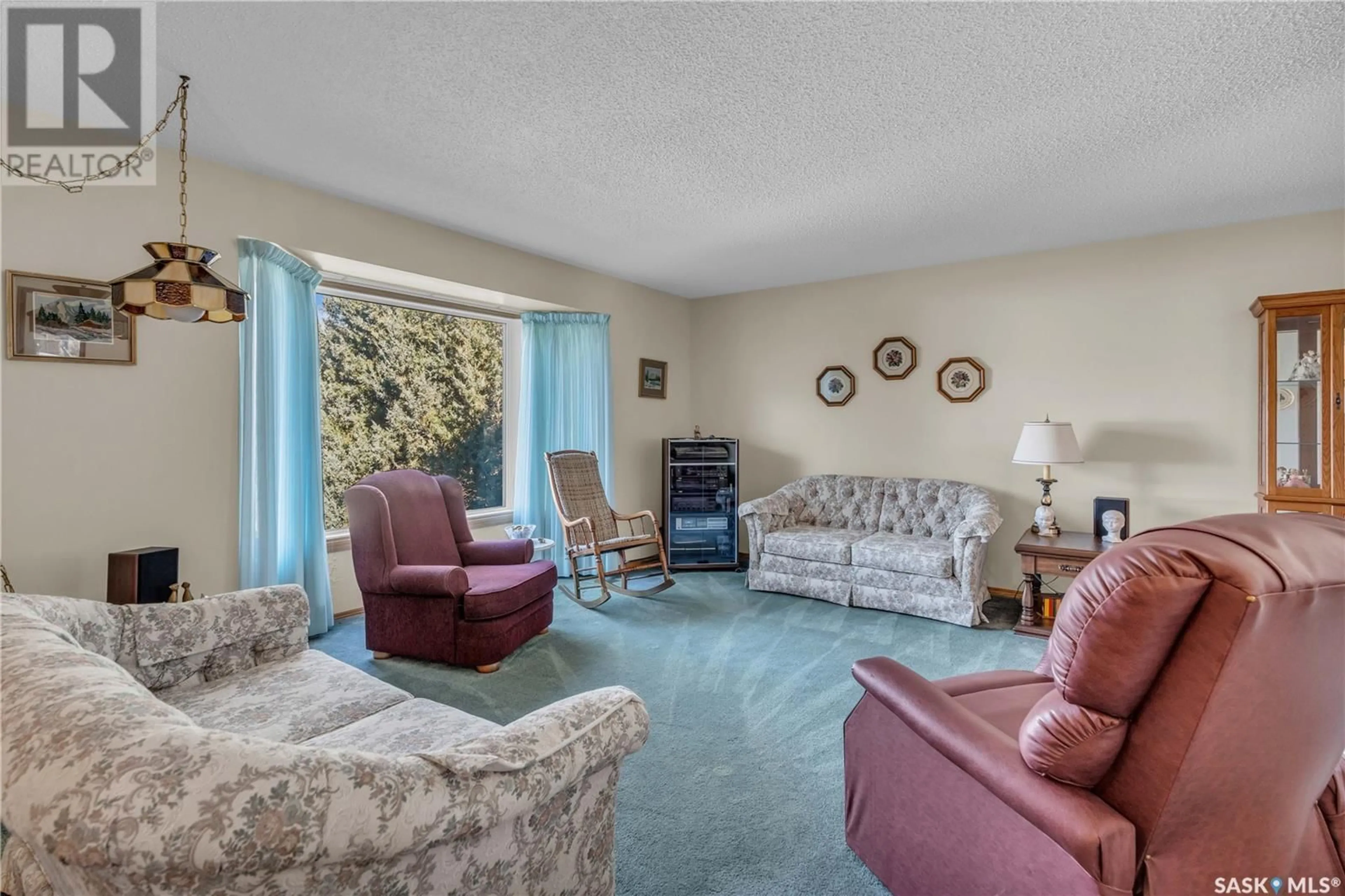 Living room with furniture, carpet floor for 179 ROGERS ROAD, Regina Saskatchewan S4S6V1