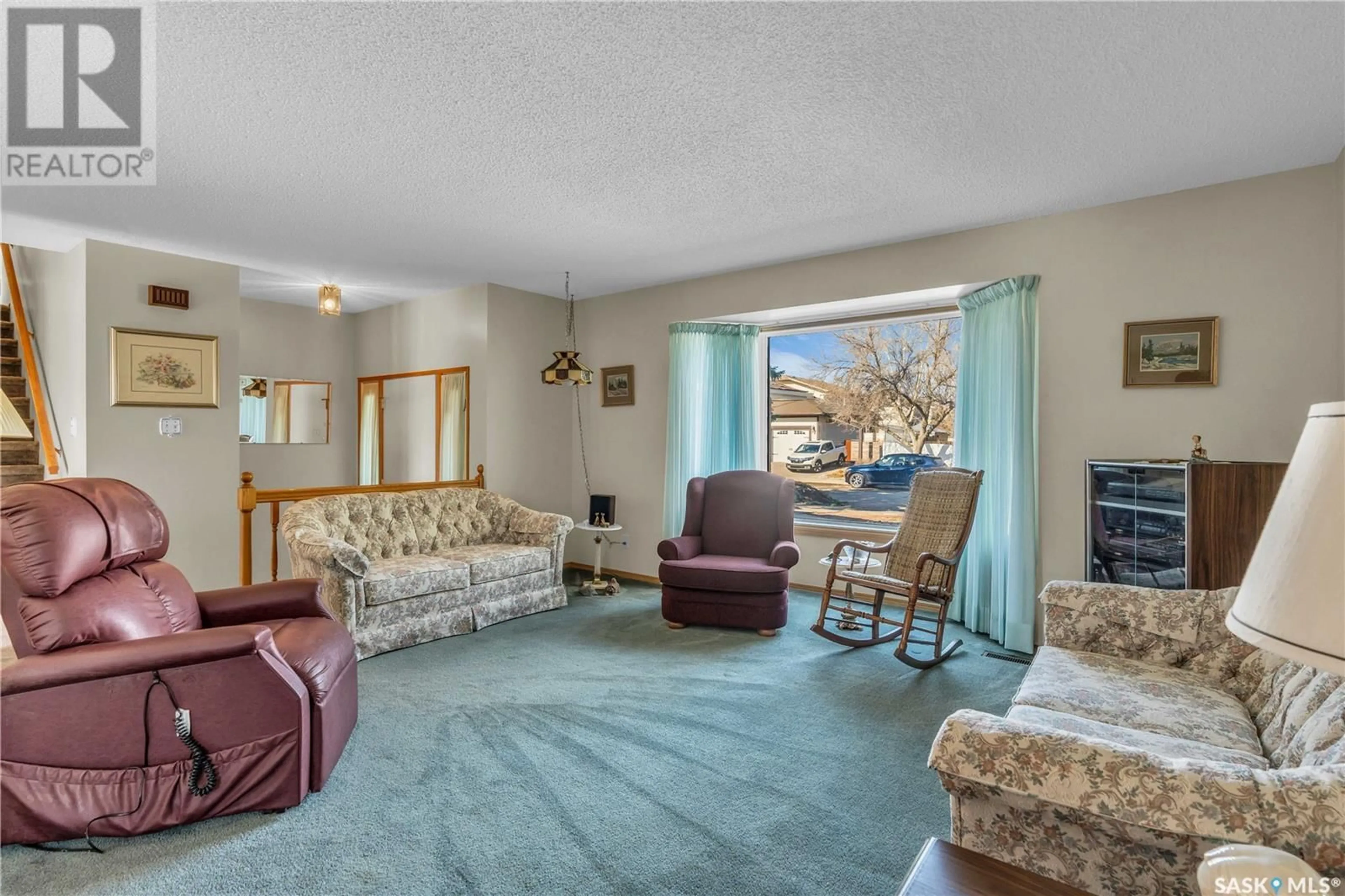 Living room with furniture, carpet floor for 179 ROGERS ROAD, Regina Saskatchewan S4S6V1