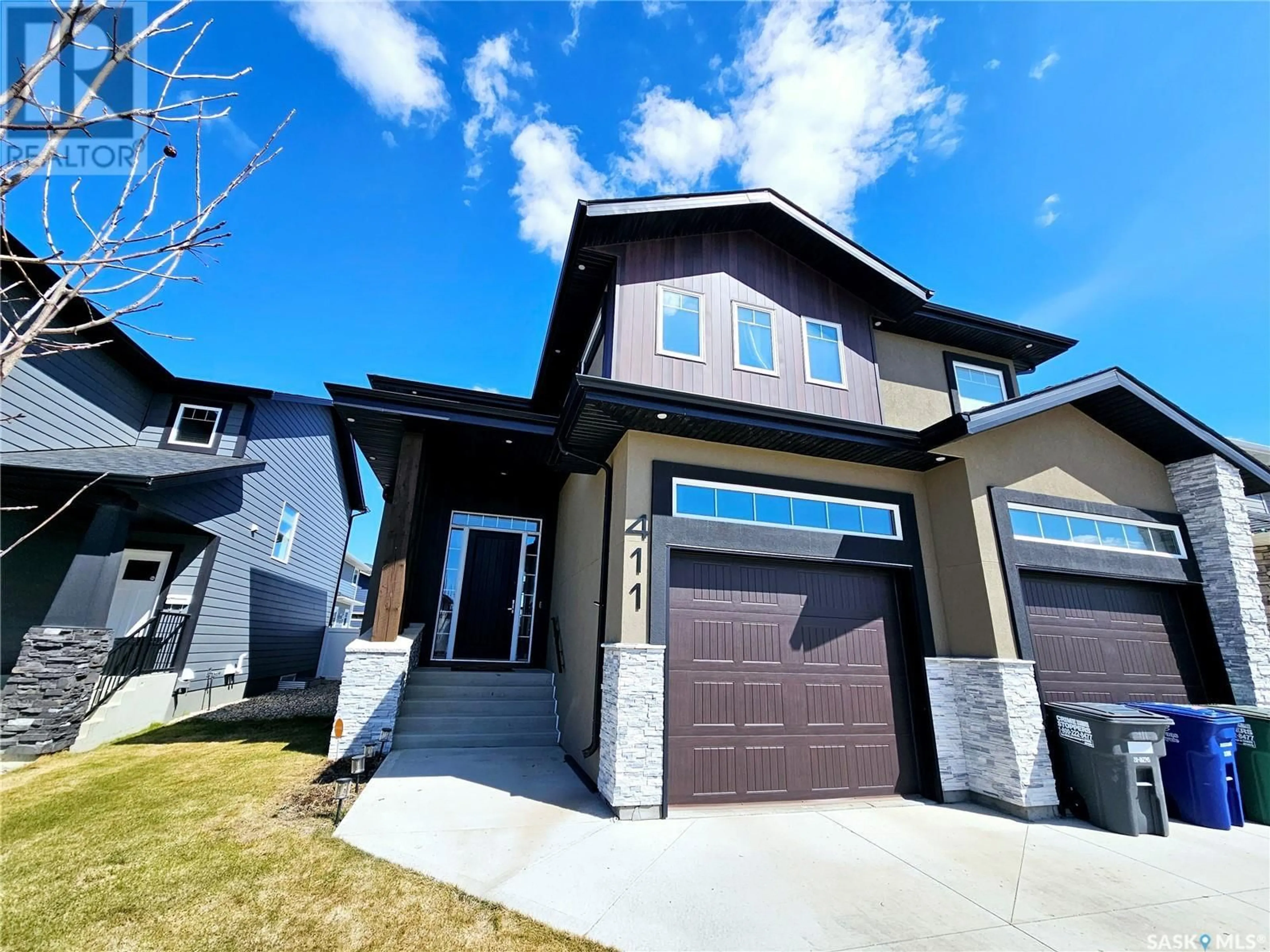 Home with vinyl exterior material, street for 411 DAGNONE TERRACE, Saskatoon Saskatchewan S7V0P7