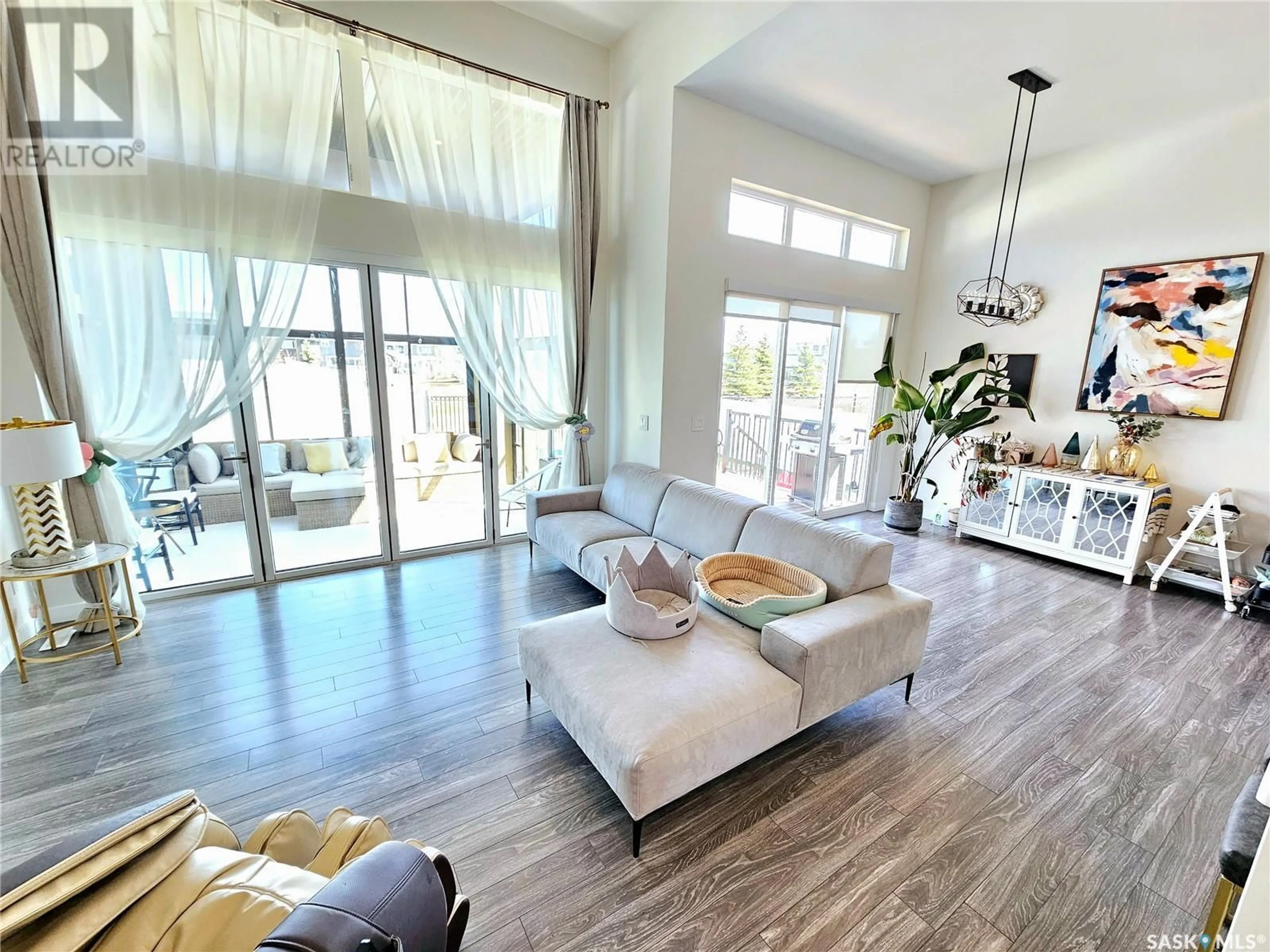 Living room with furniture, unknown for 411 DAGNONE TERRACE, Saskatoon Saskatchewan S7V0P7