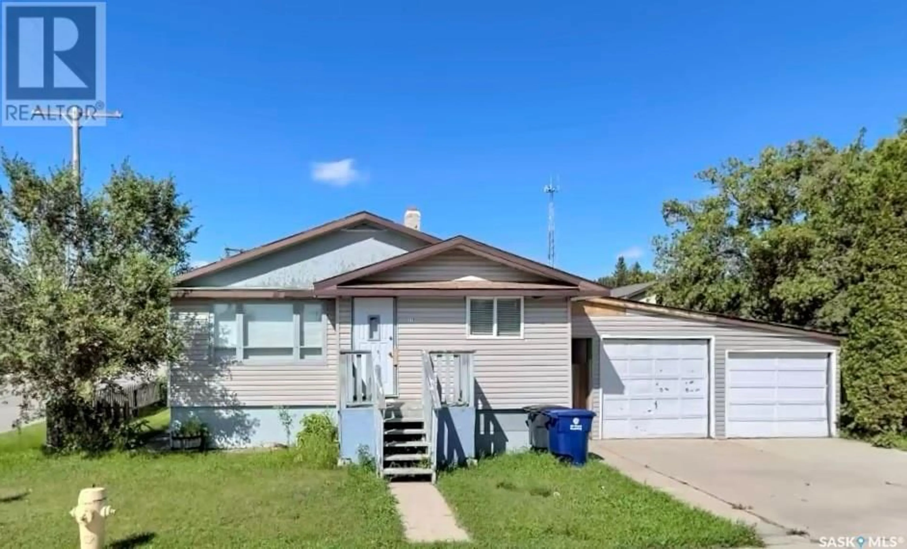 Home with vinyl exterior material, street for 319 6TH AVENUE, Biggar Saskatchewan S0K0M0