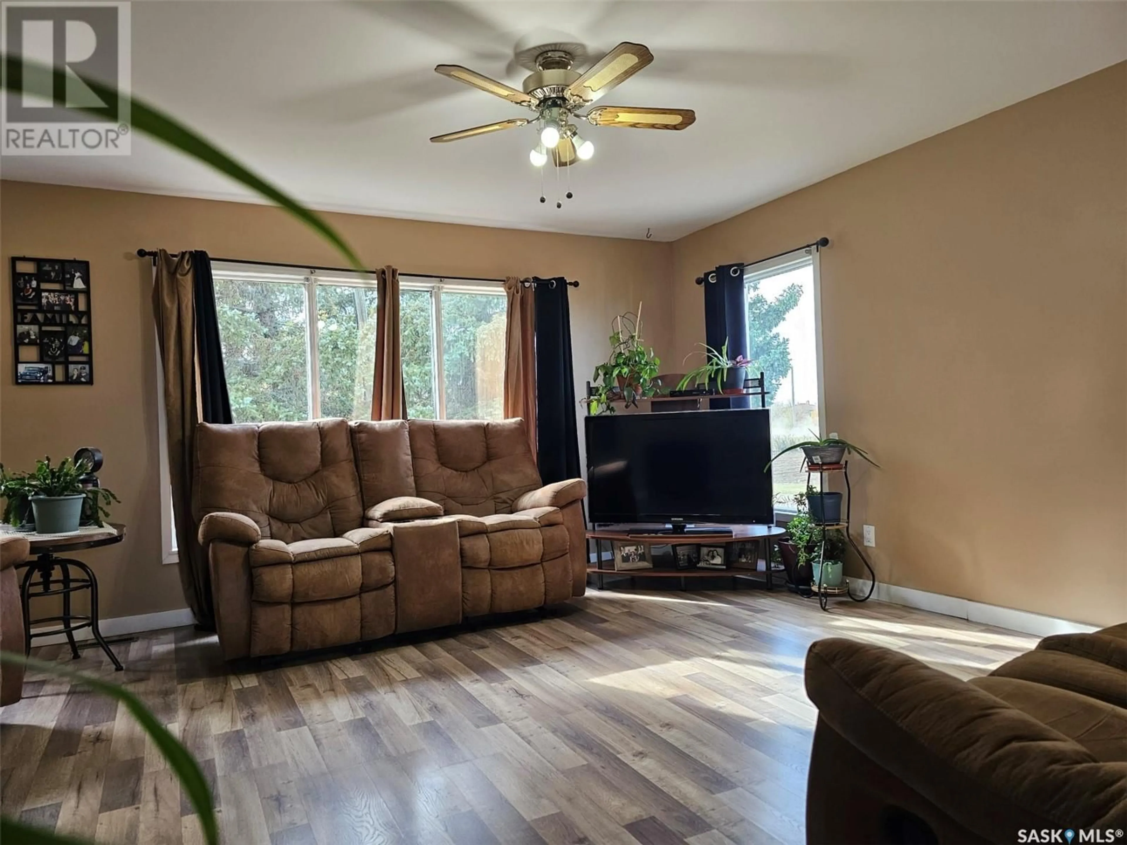 Living room with furniture, wood/laminate floor for 132 CENTENNIAL STREET, Swift Current Rm No. 137 Saskatchewan S0N2Y0