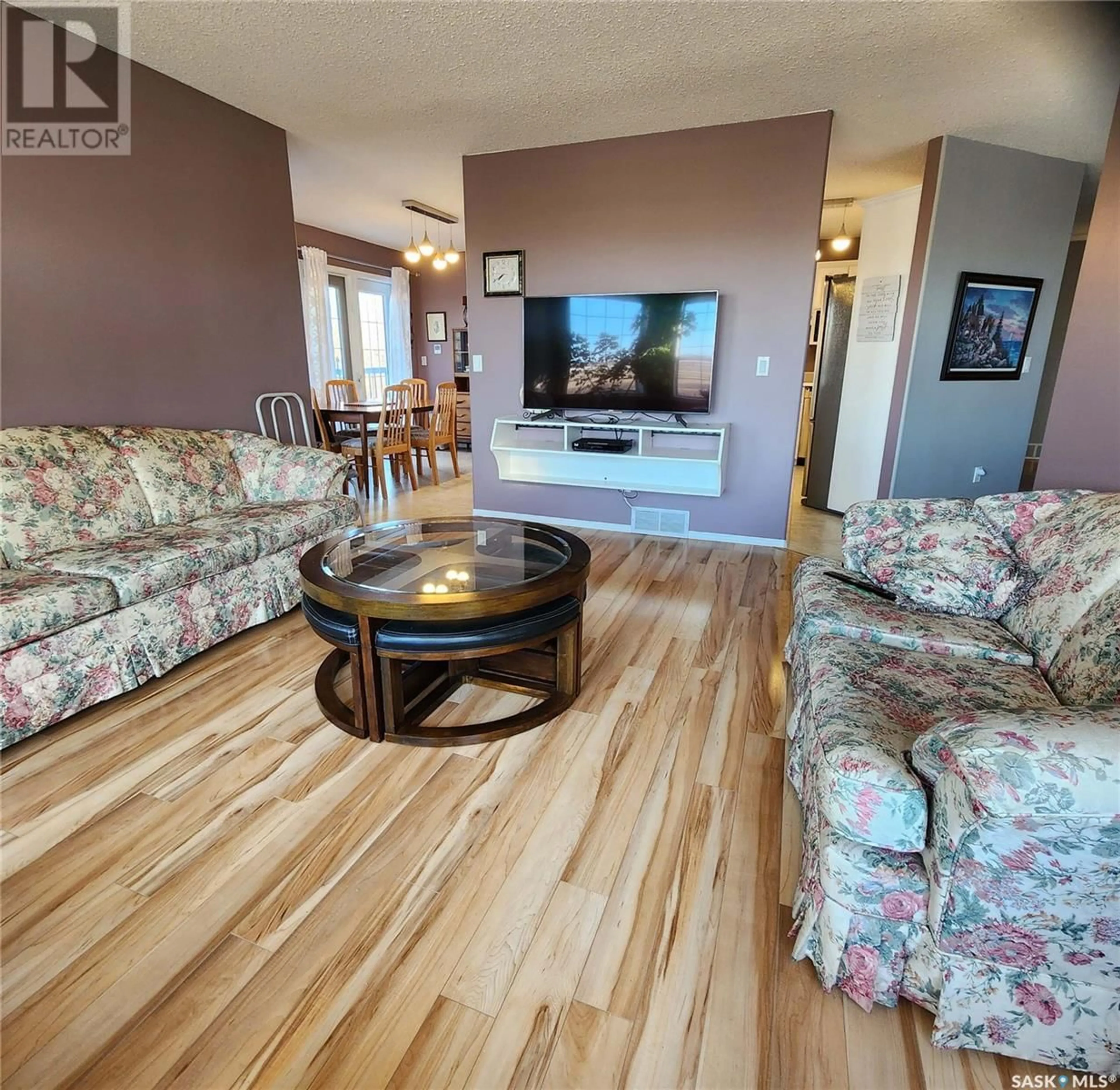 Living room with furniture, wood/laminate floor for 113 WIND RIVER ESTATES, Clavet Saskatchewan S0K0Y0