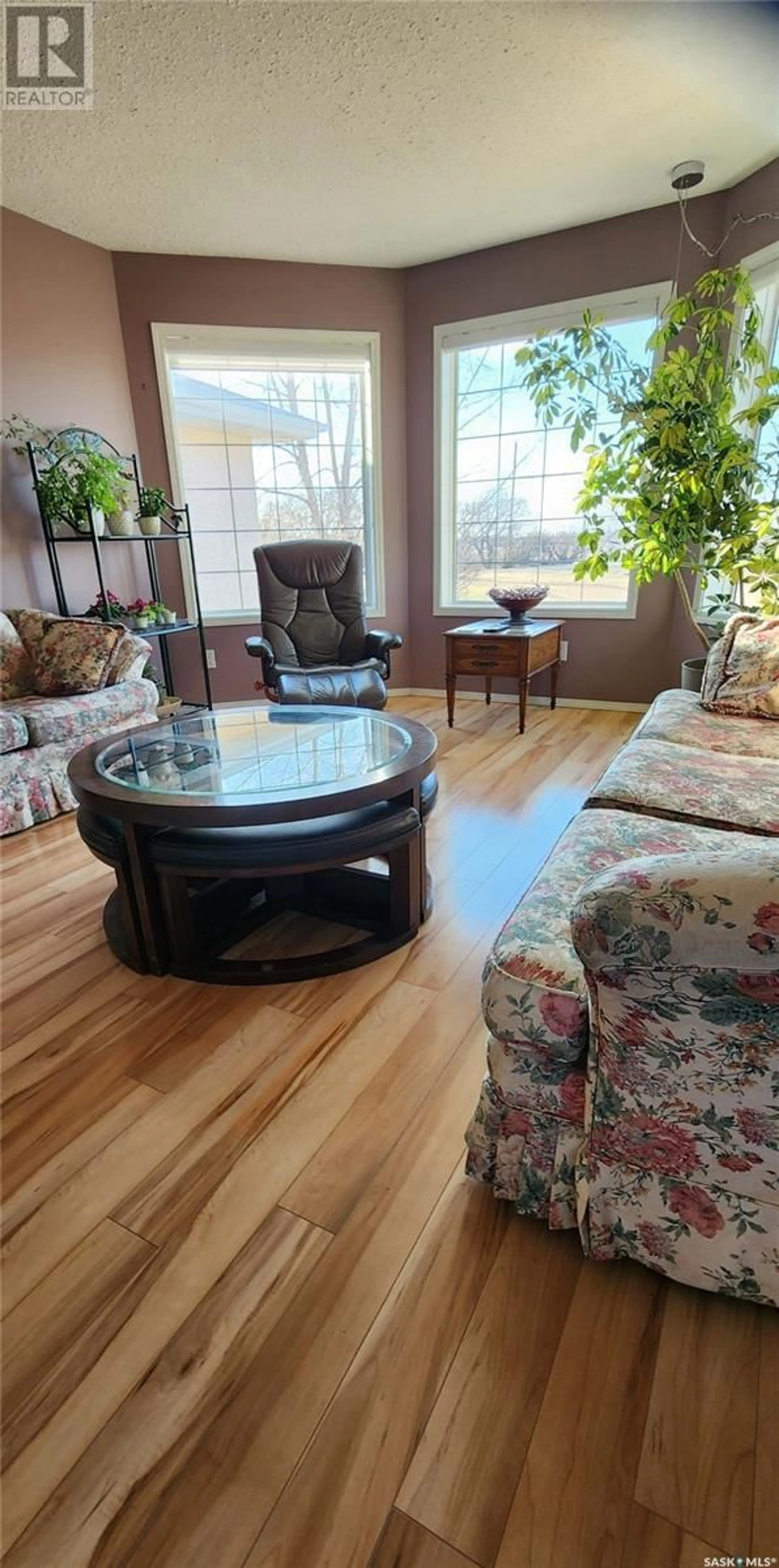 Living room with furniture, wood/laminate floor for 113 WIND RIVER ESTATES, Clavet Saskatchewan S0K0Y0