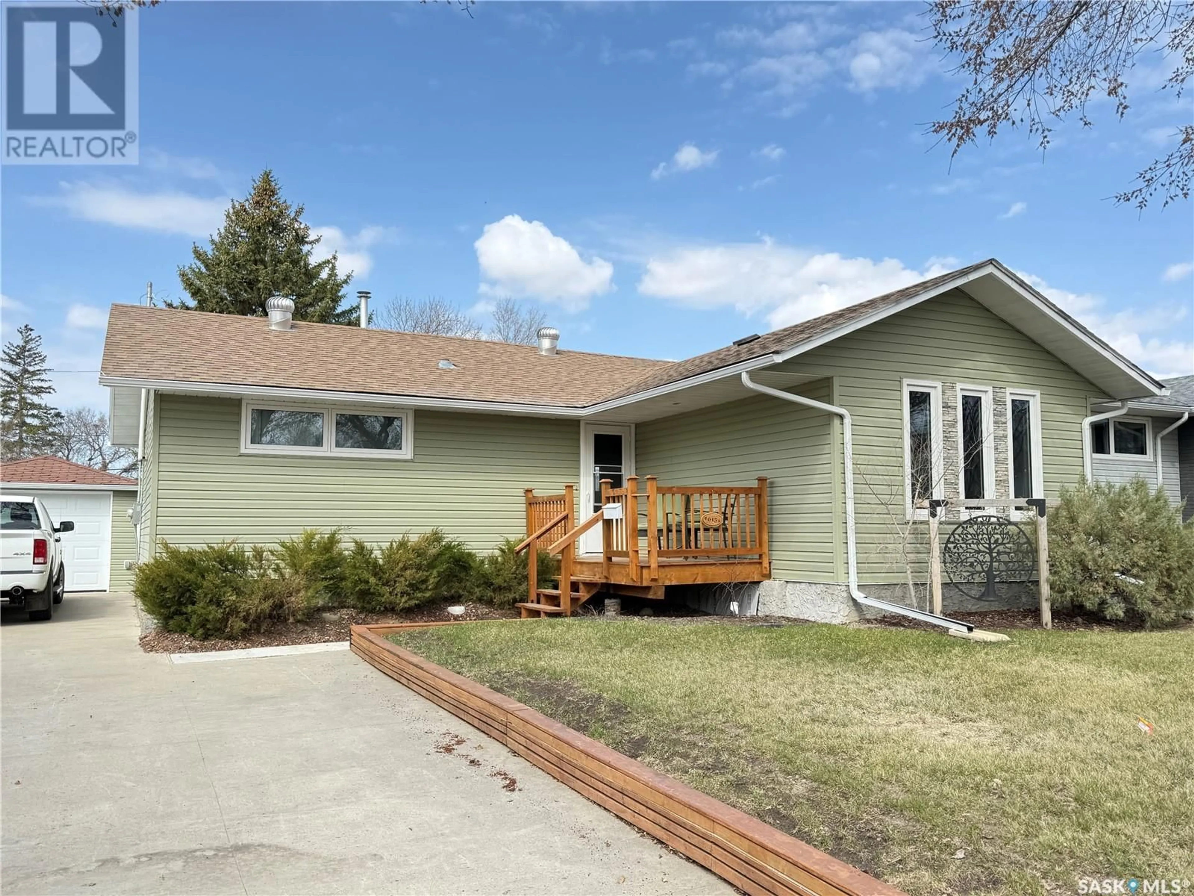 Home with vinyl exterior material, street for 615 WINDSOR STREET, Weyburn Saskatchewan S4H0X1