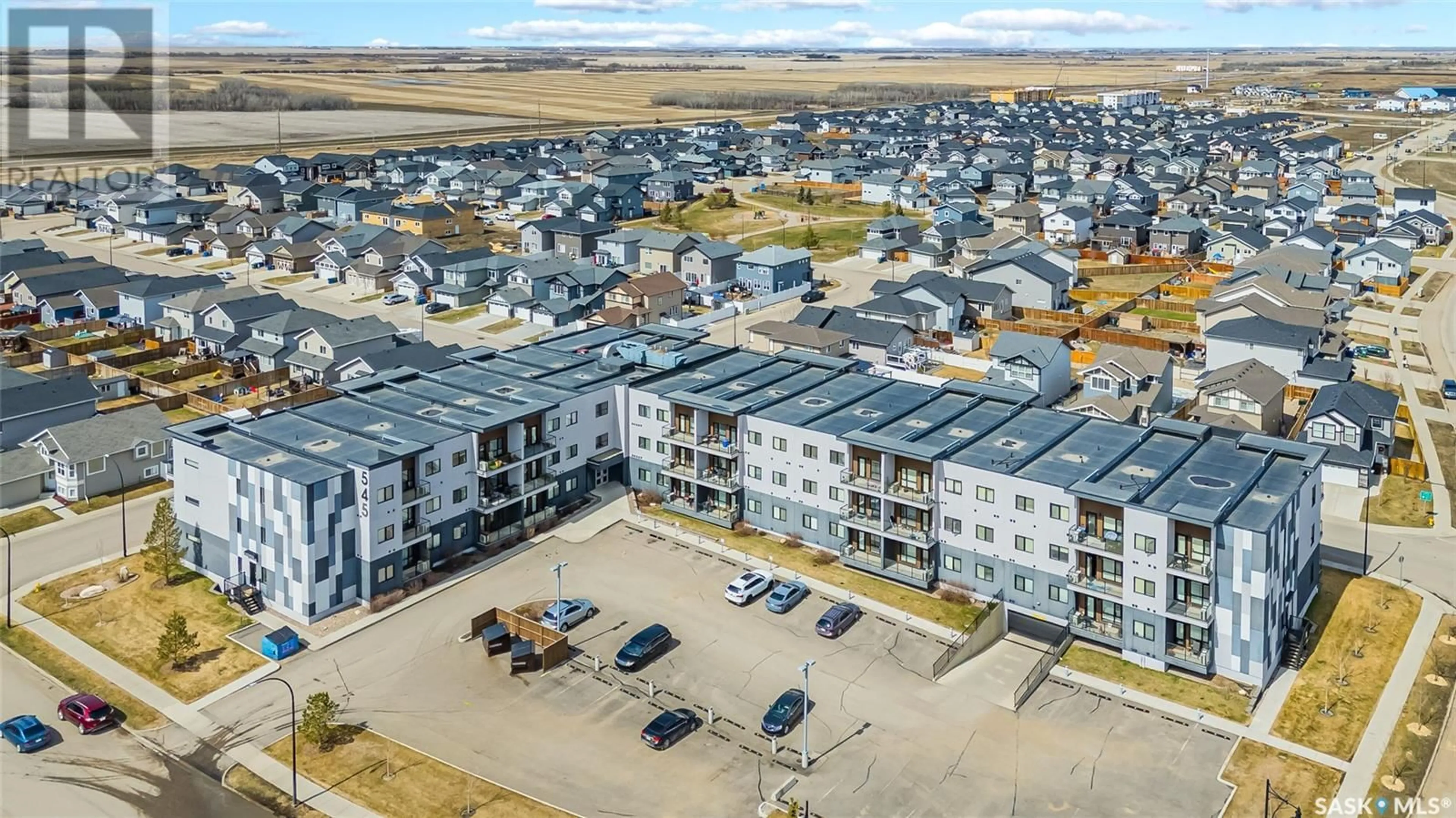 A pic from outside/outdoor area/front of a property/back of a property/a pic from drone, unknown for 219 545 HASSARD CLOSE, Saskatoon Saskatchewan S7L6V3