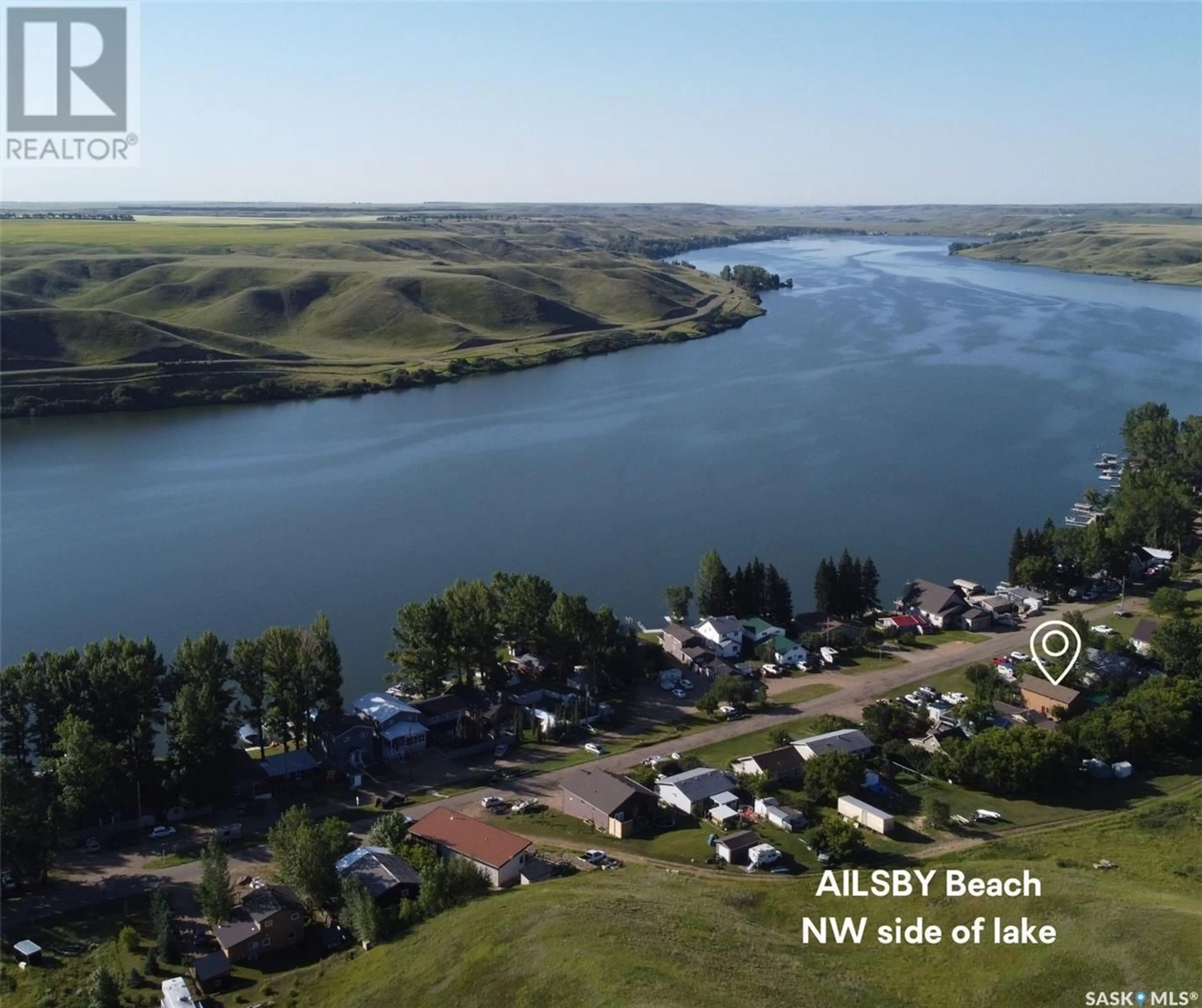 A pic from outside/outdoor area/front of a property/back of a property/a pic from drone, water/lake/river/ocean view for 205 WALL RIDGE TRAIL, Lac Pelletier Saskatchewan S0N2Y0