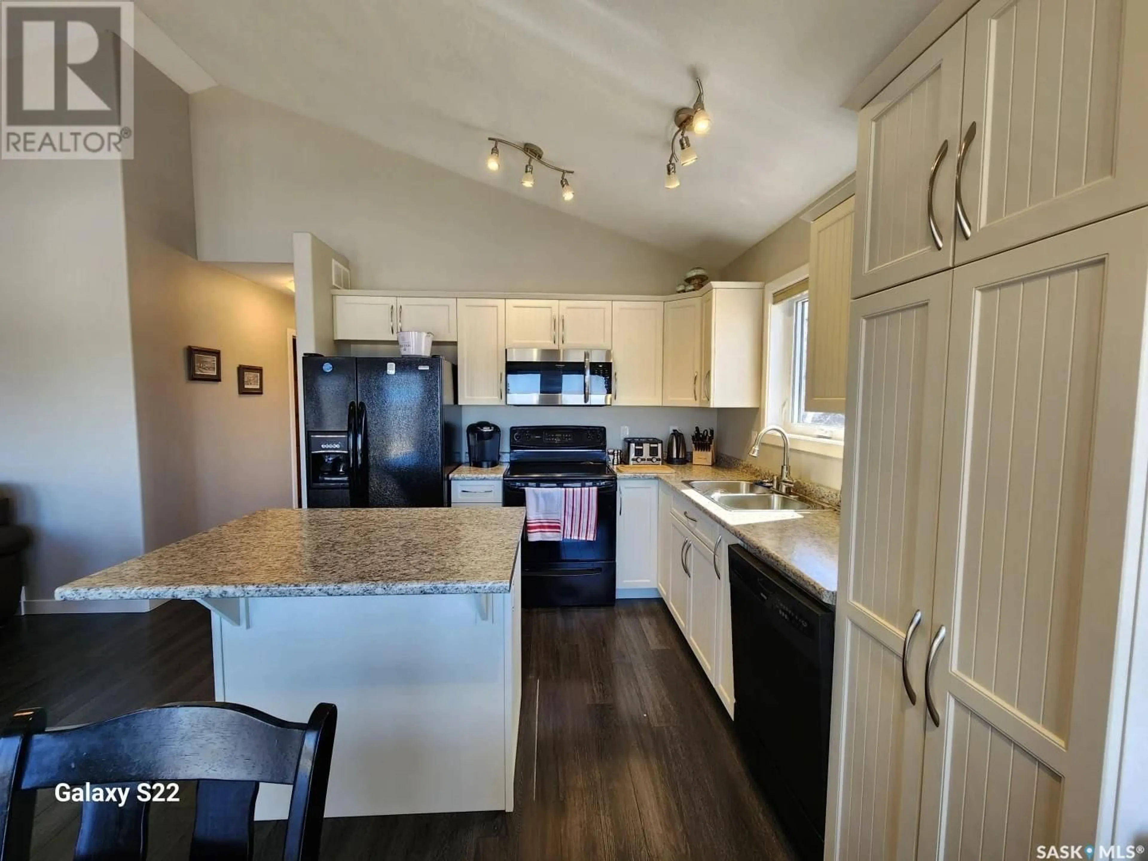 Open concept kitchen, wood/laminate floor for 29 TRANQUILITY HEIGHTS, Big River Rm No. 555 Saskatchewan S0J0E0