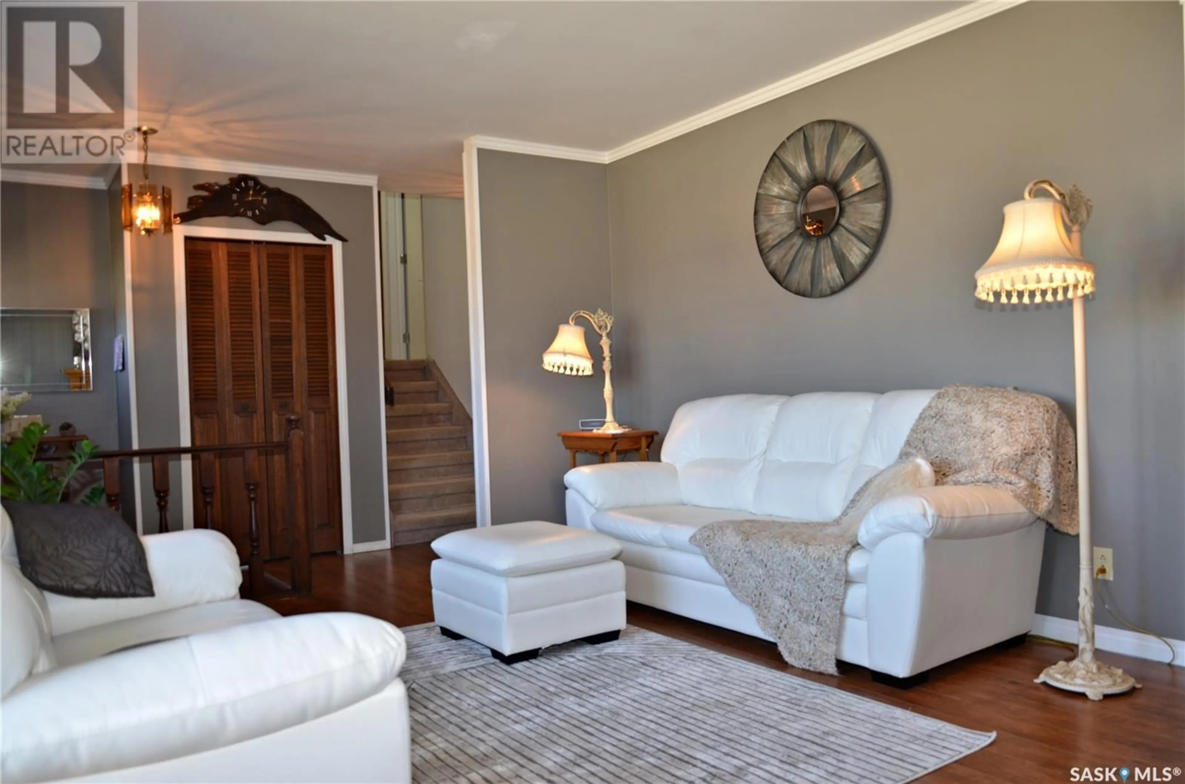 Living room with furniture, wood/laminate floor for 720 PORTAGE AVENUE, Wadena Saskatchewan S0A0C1