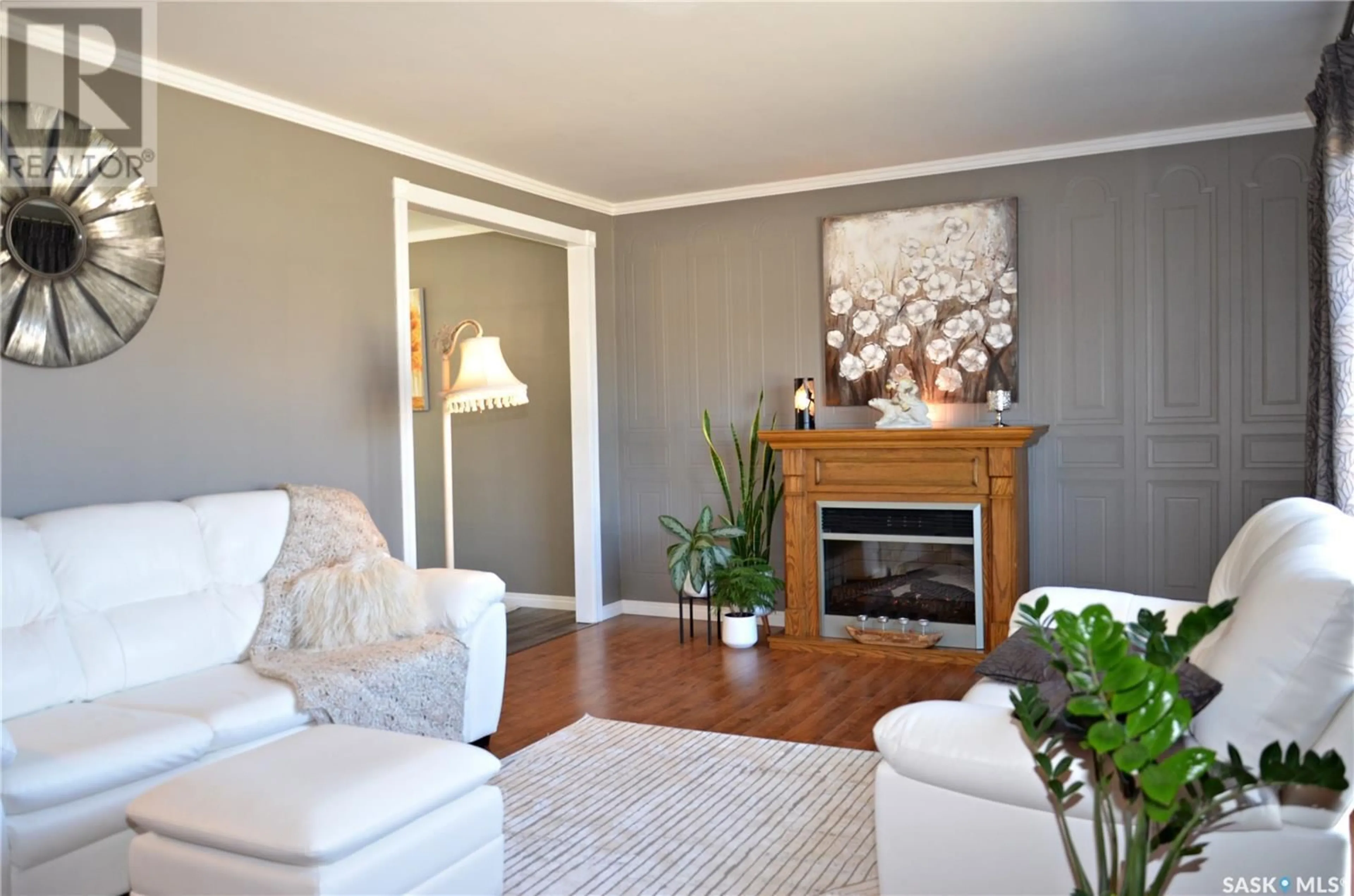 Living room with furniture, wood/laminate floor for 720 PORTAGE AVENUE, Wadena Saskatchewan S0A0C1