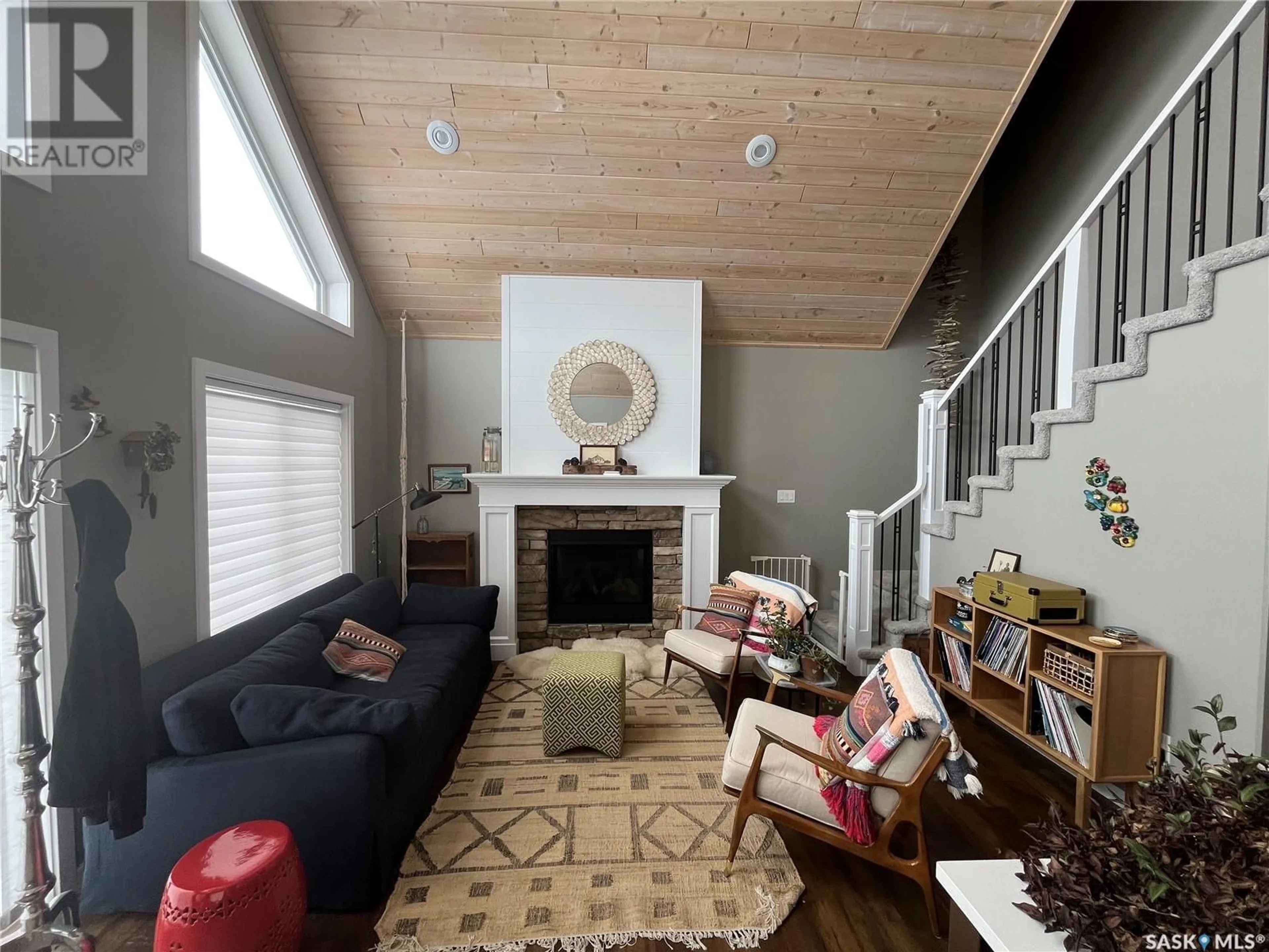 Living room with furniture, wood/laminate floor for 203 LAKESHORE DRIVE, Leslie Beach Saskatchewan S0A1A0