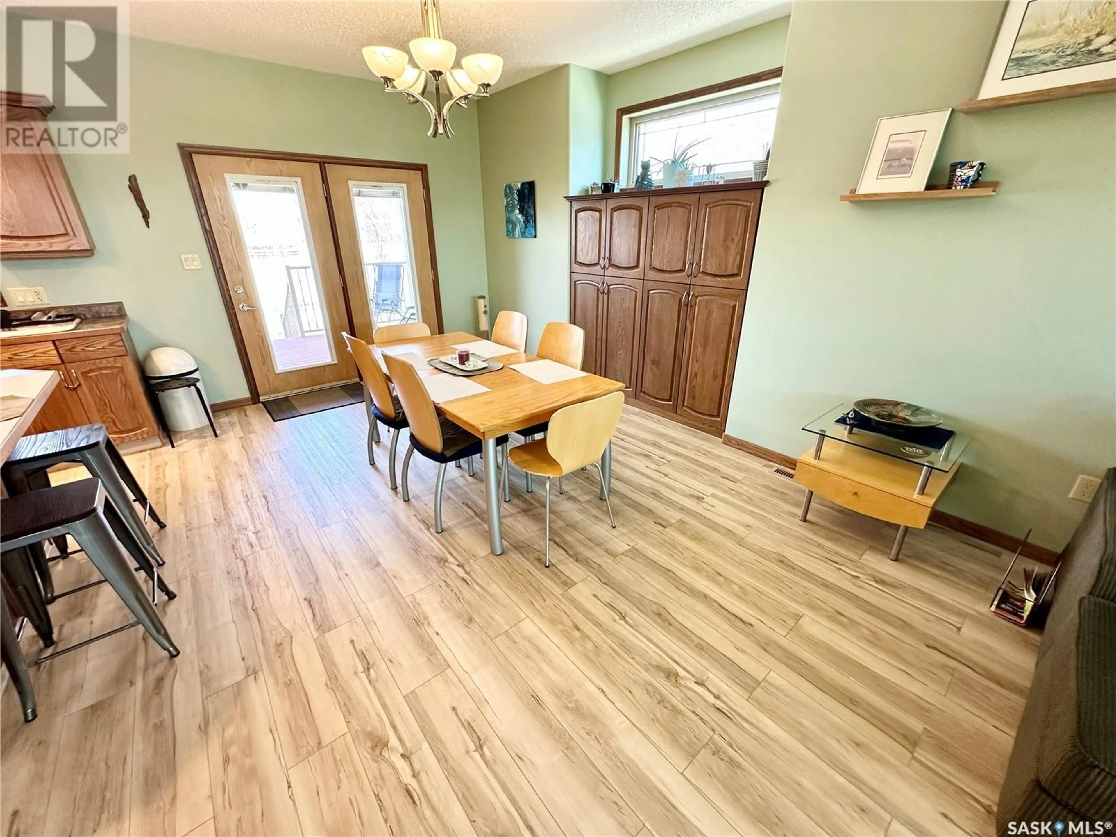 Dining room, wood/laminate floor for 1815 GORDON MILES PLACE, Weyburn Saskatchewan S4H0B9