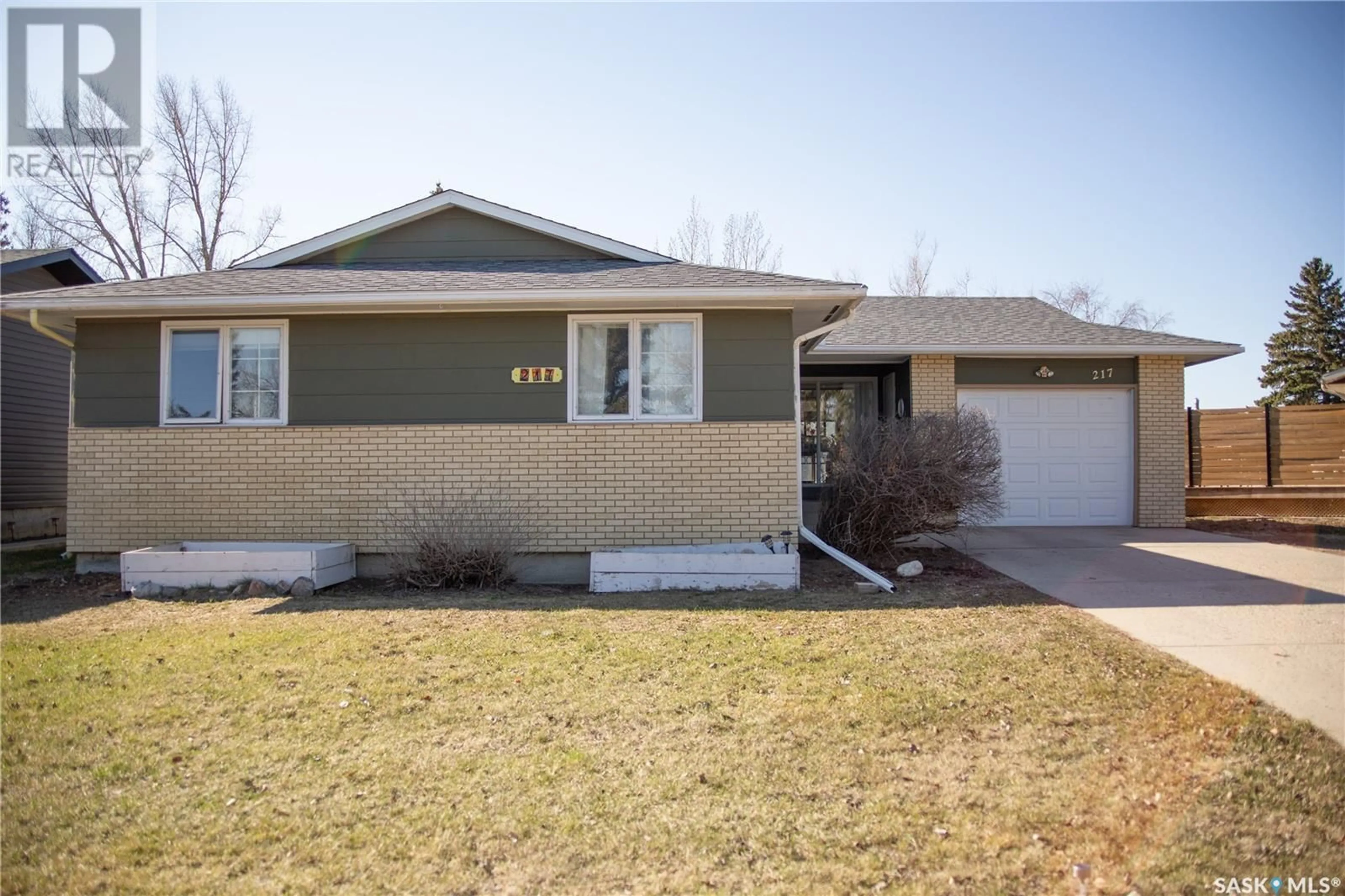 Home with vinyl exterior material, street for 217 10TH AVENUE, Kindersley Saskatchewan S0L1S0