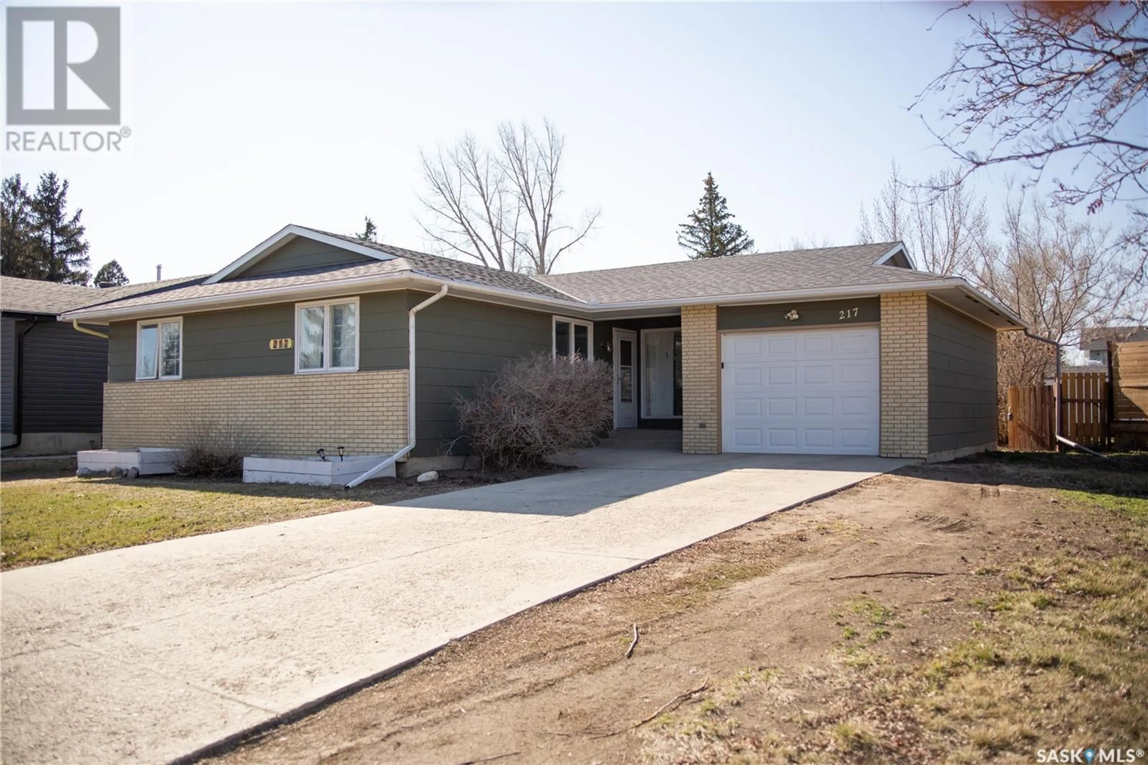Home with brick exterior material, street for 217 10TH AVENUE, Kindersley Saskatchewan S0L1S0