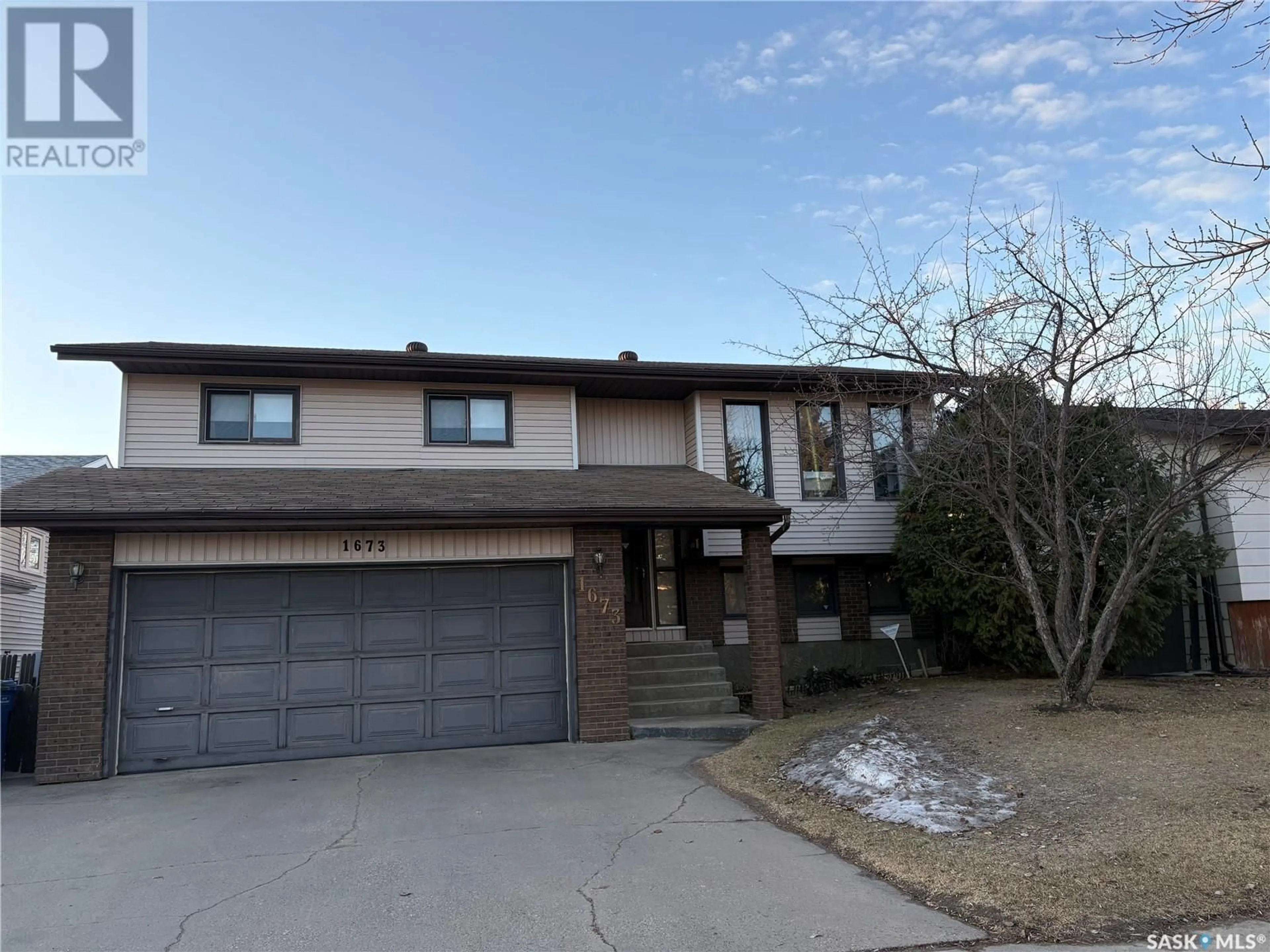 Home with brick exterior material, street for 1673 OLIVE DIEFENBAKER DRIVE, Prince Albert Saskatchewan S6V7V9