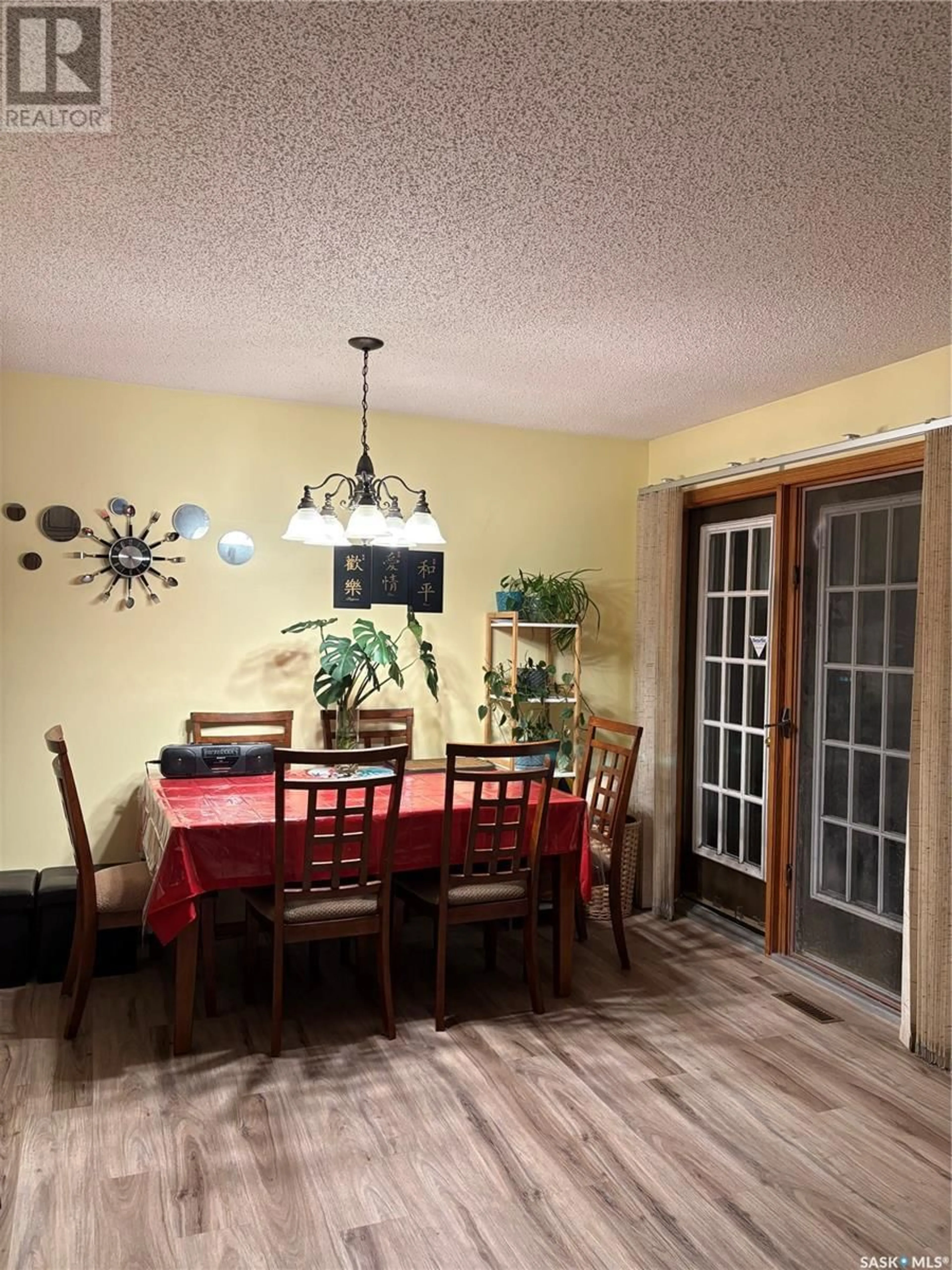 Dining room, wood/laminate floor for 1673 OLIVE DIEFENBAKER DRIVE, Prince Albert Saskatchewan S6V7V9