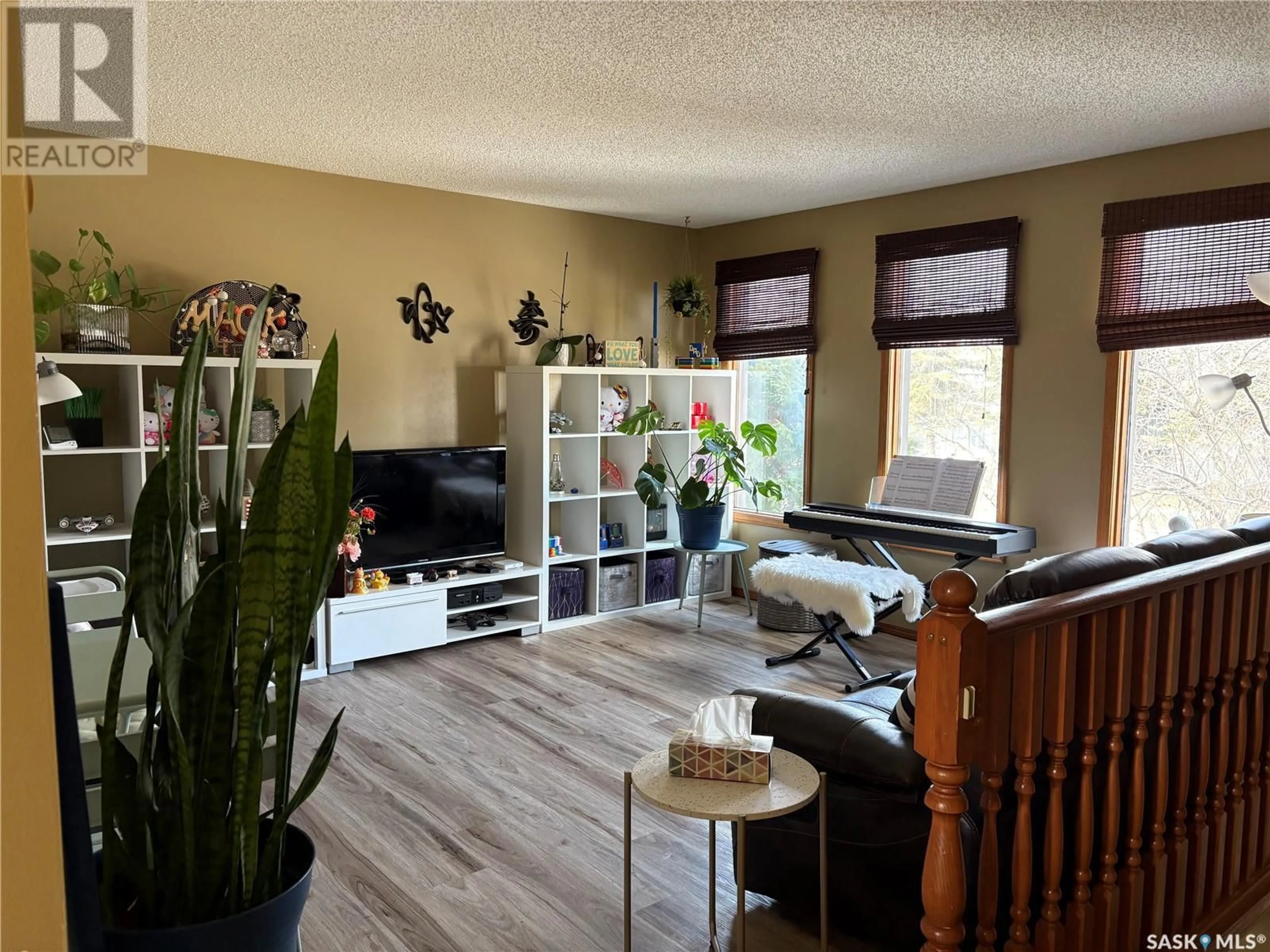 Living room with furniture, wood/laminate floor for 1673 OLIVE DIEFENBAKER DRIVE, Prince Albert Saskatchewan S6V7V9