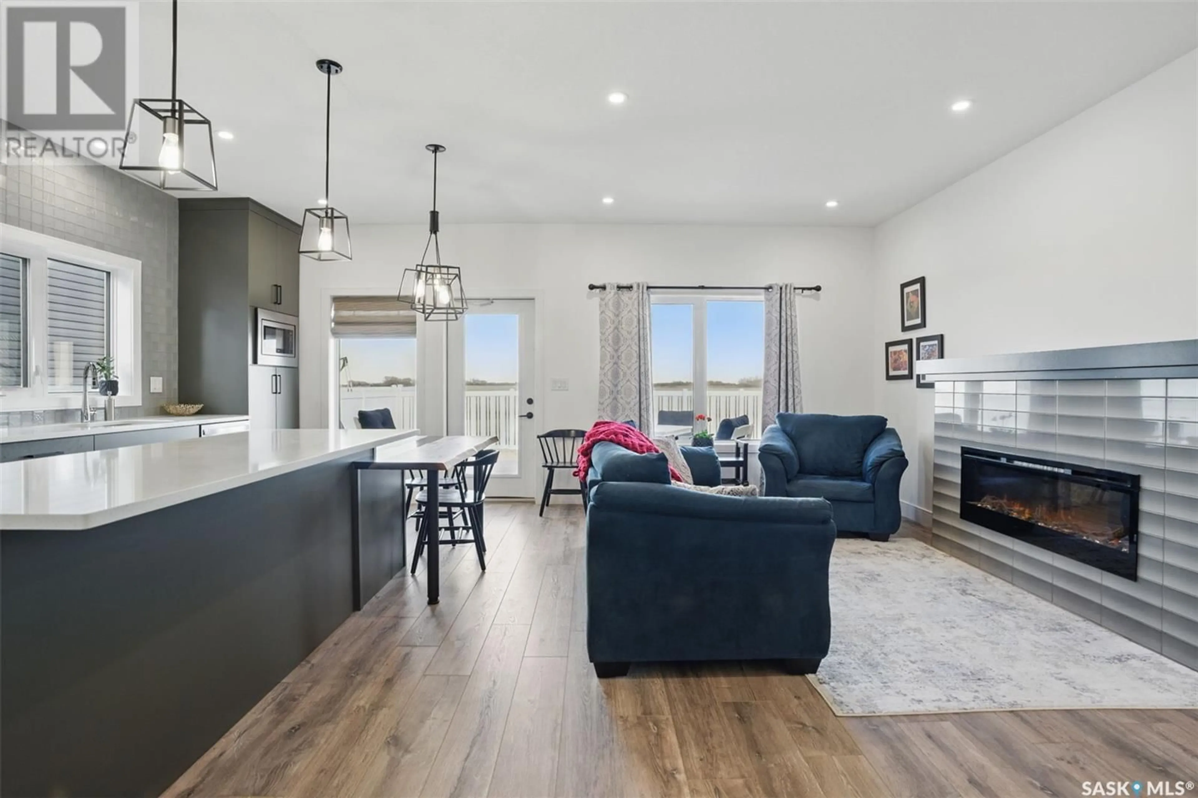 Open concept kitchen, wood/laminate floor for 16 WALKER WAY, Clavet Saskatchewan S0K0Y0