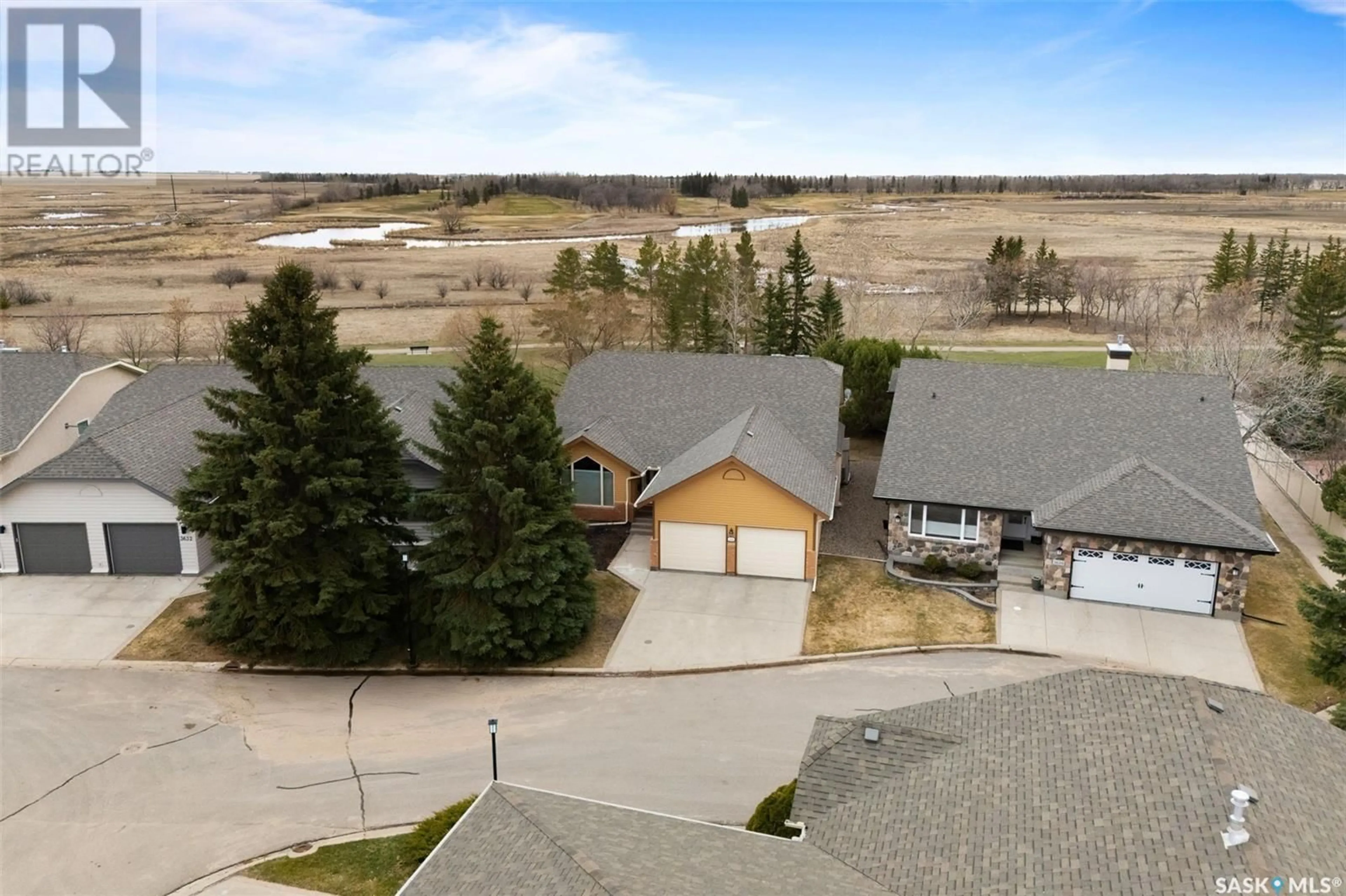 A pic from outside/outdoor area/front of a property/back of a property/a pic from drone, mountain view for 3630 WEDGWOOD WAY, Regina Saskatchewan S4V2M5