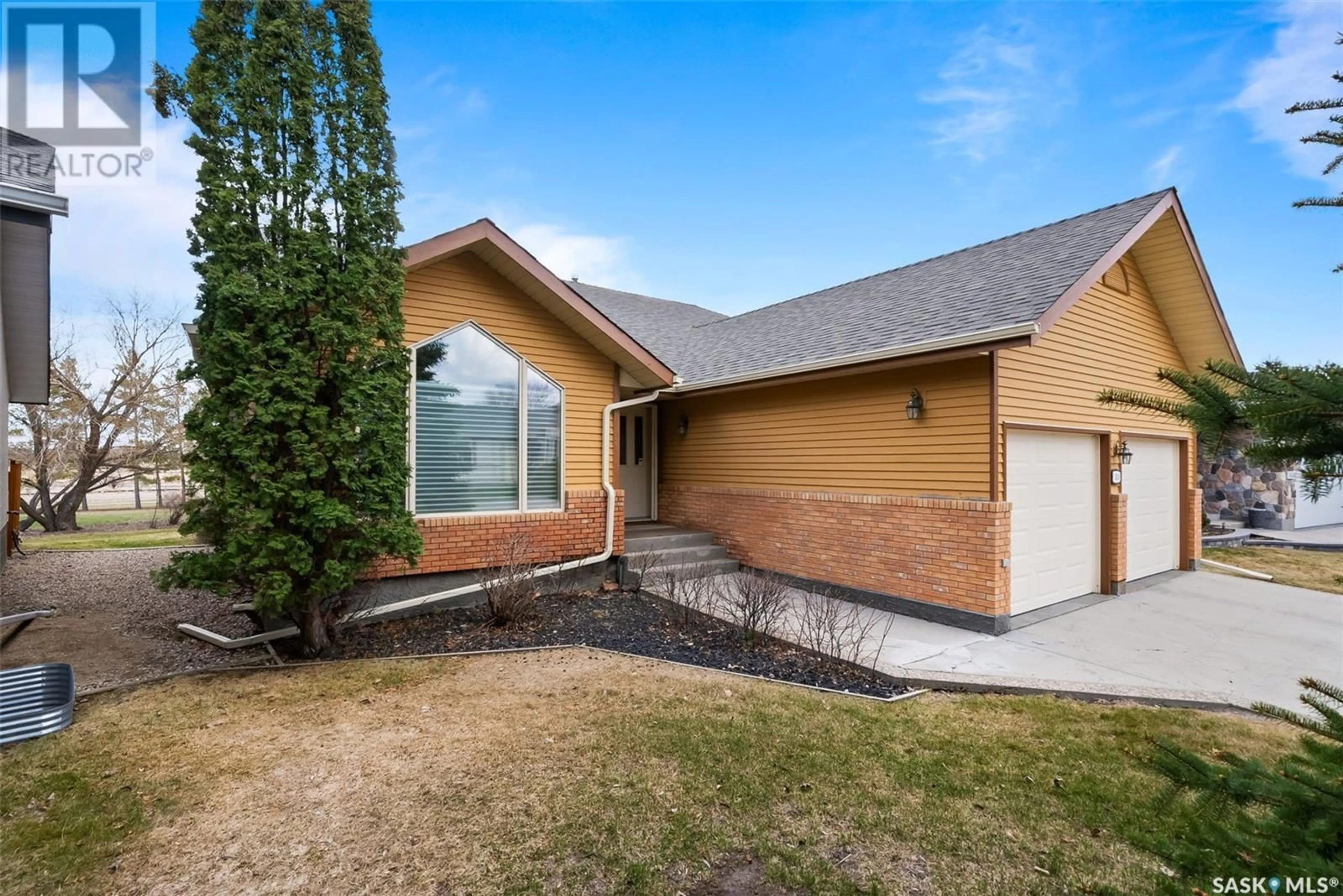 Home with brick exterior material, street for 3630 WEDGWOOD WAY, Regina Saskatchewan S4V2M5