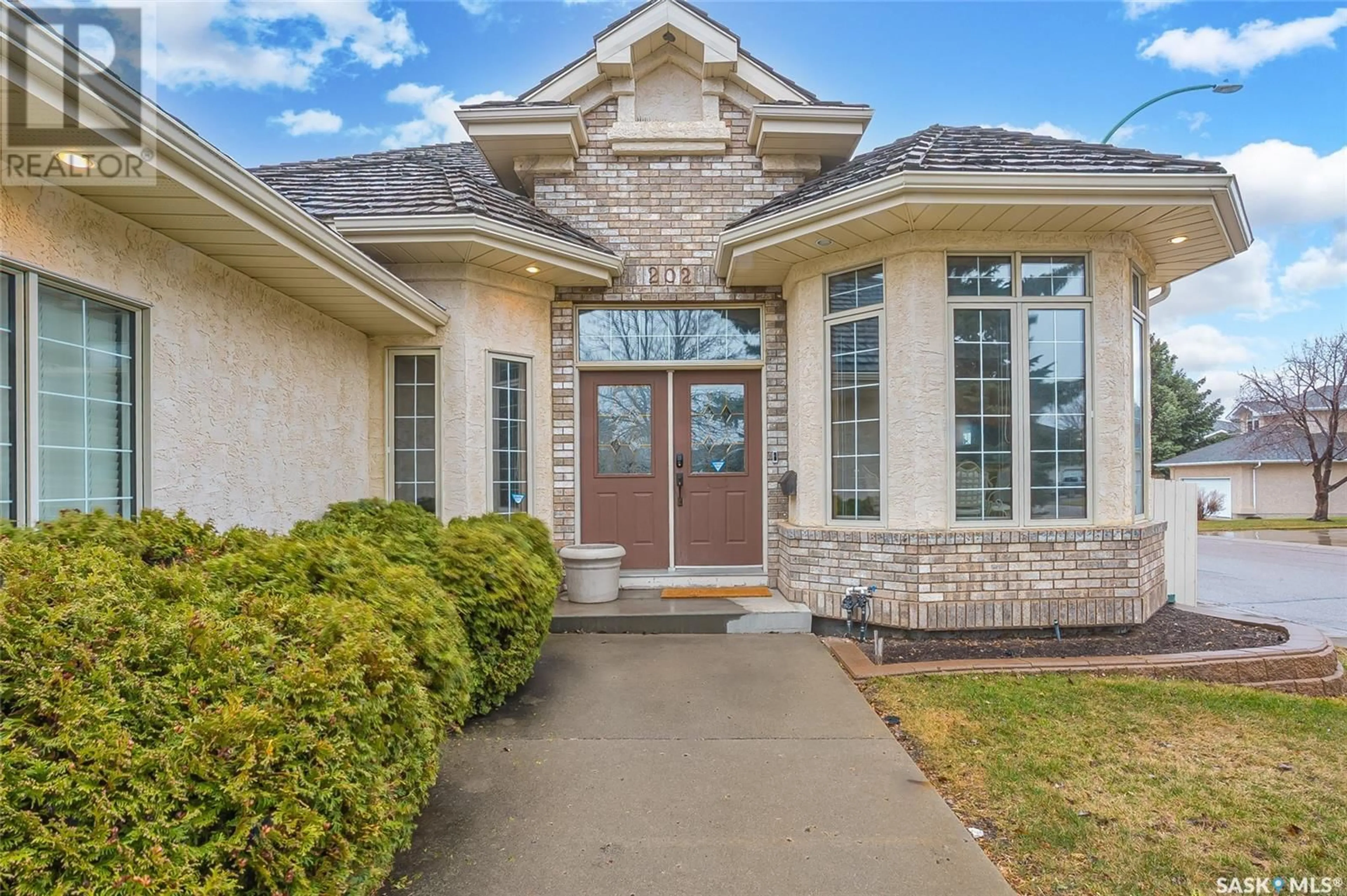 Home with brick exterior material, street for 202 COLLINS TERRACE, Saskatoon Saskatchewan S7N4K7