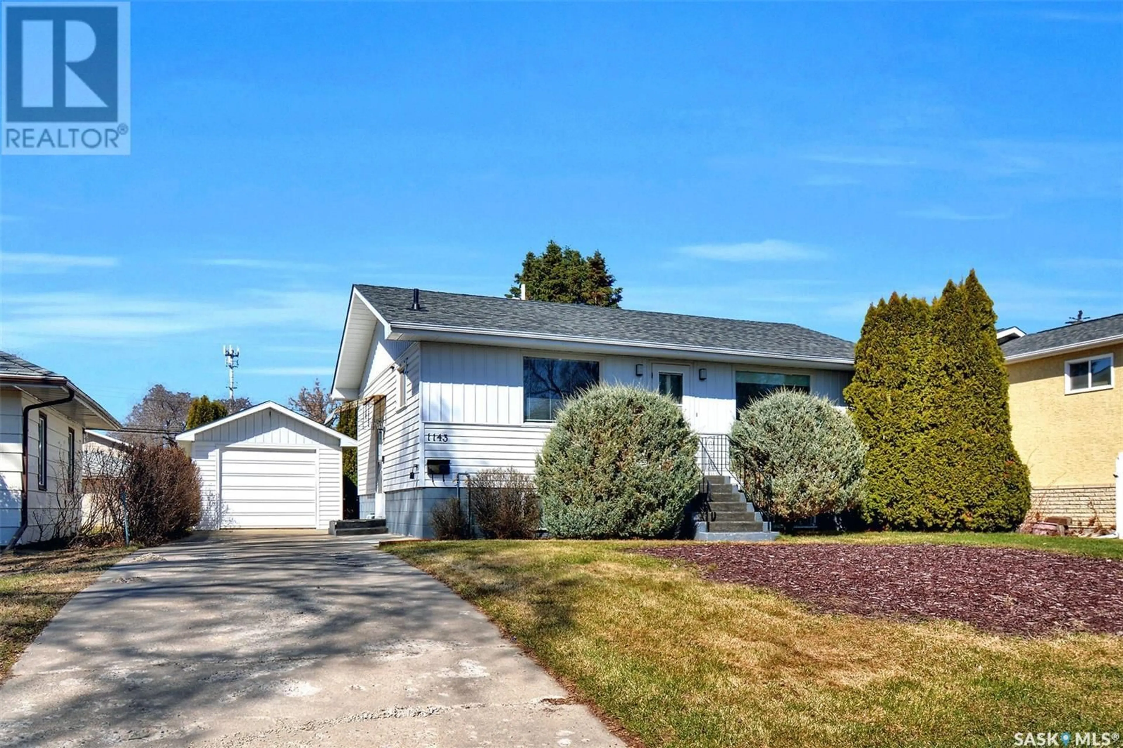 Home with vinyl exterior material, street for 1143 O AVENUE, Saskatoon Saskatchewan S7M2T3