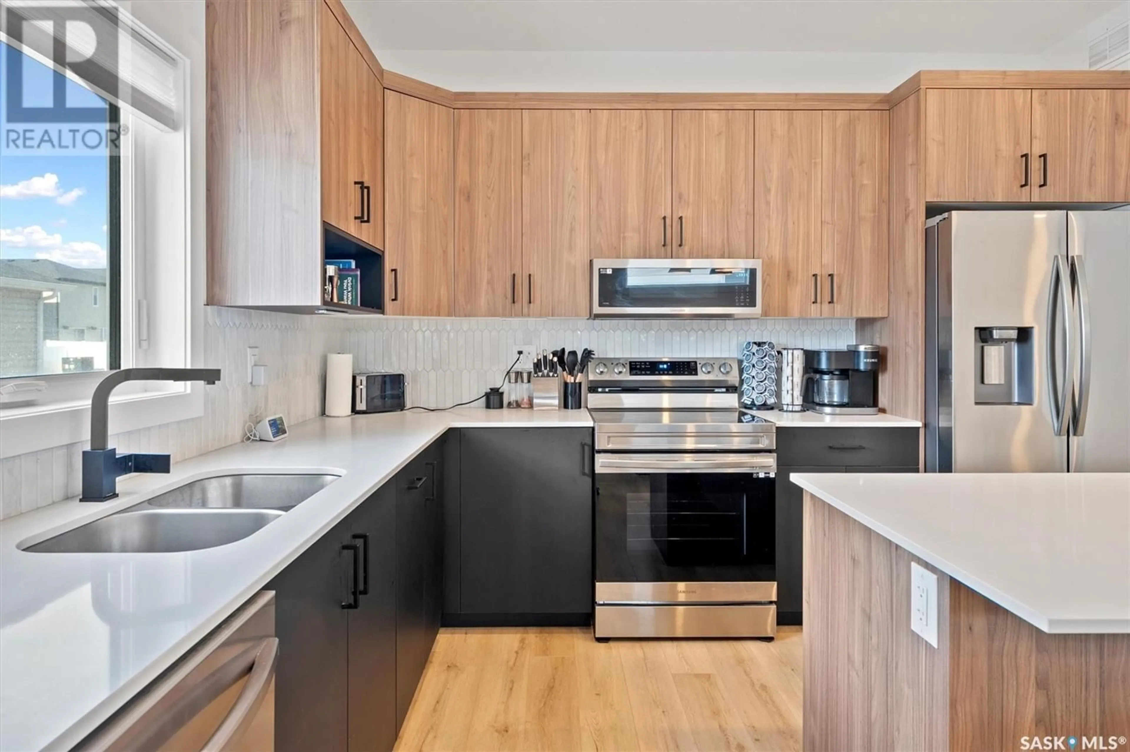 Standard kitchen, wood/laminate floor for 106 TAUBE AVENUE, Saskatoon Saskatchewan S7V1L6