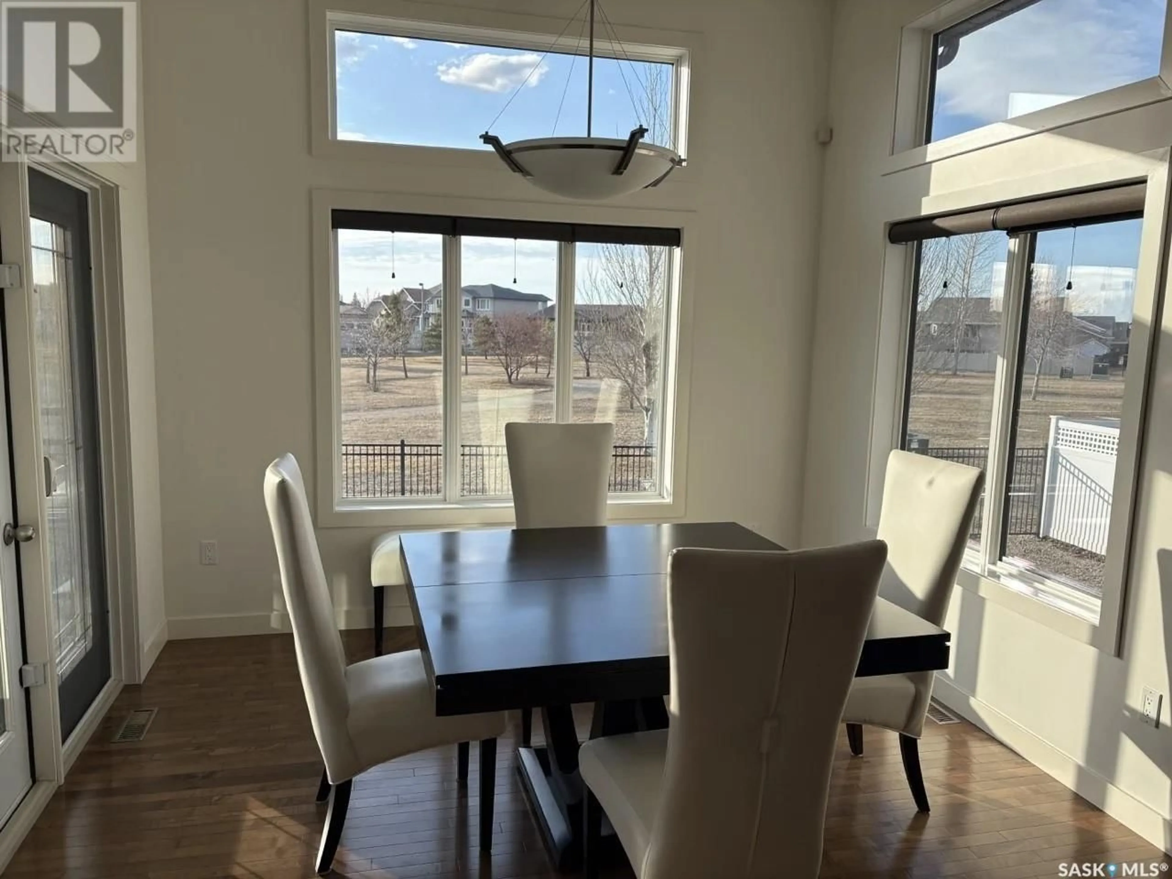 Dining room, wood/laminate floor for 62 ASPEN PLACE, Yorkton Saskatchewan S3N0C5