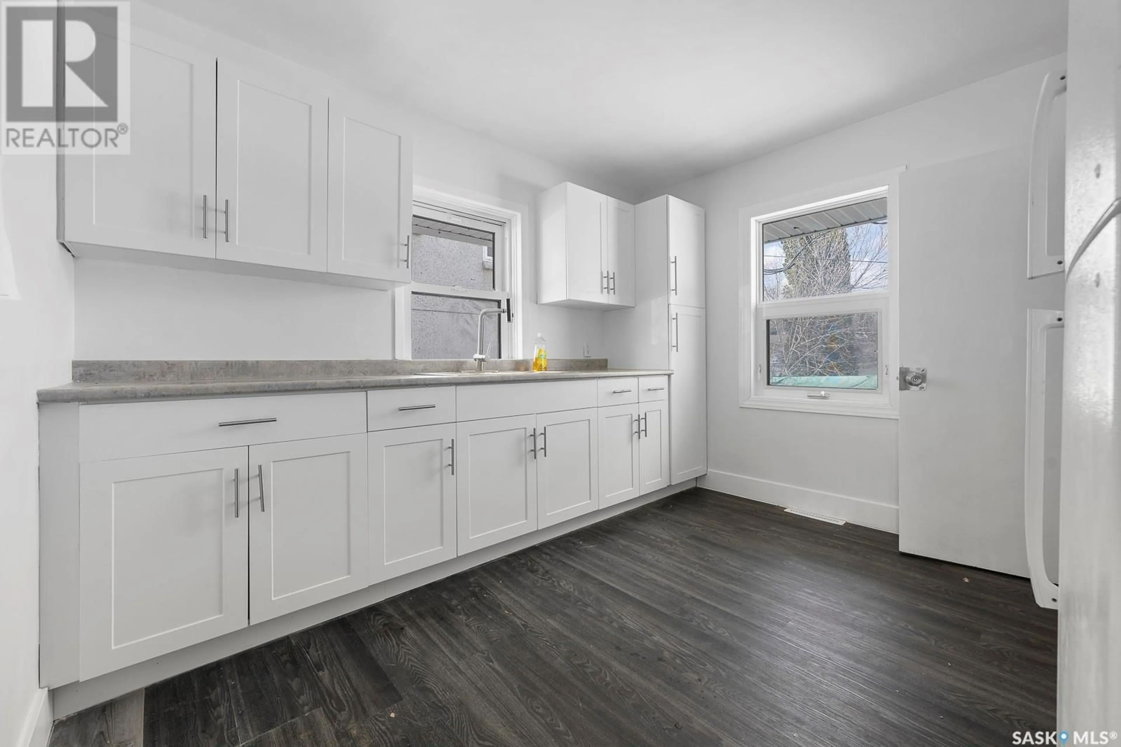 Open concept kitchen, wood/laminate floor for 222 COLLEGE AVENUE, Regina Saskatchewan S4N0V6